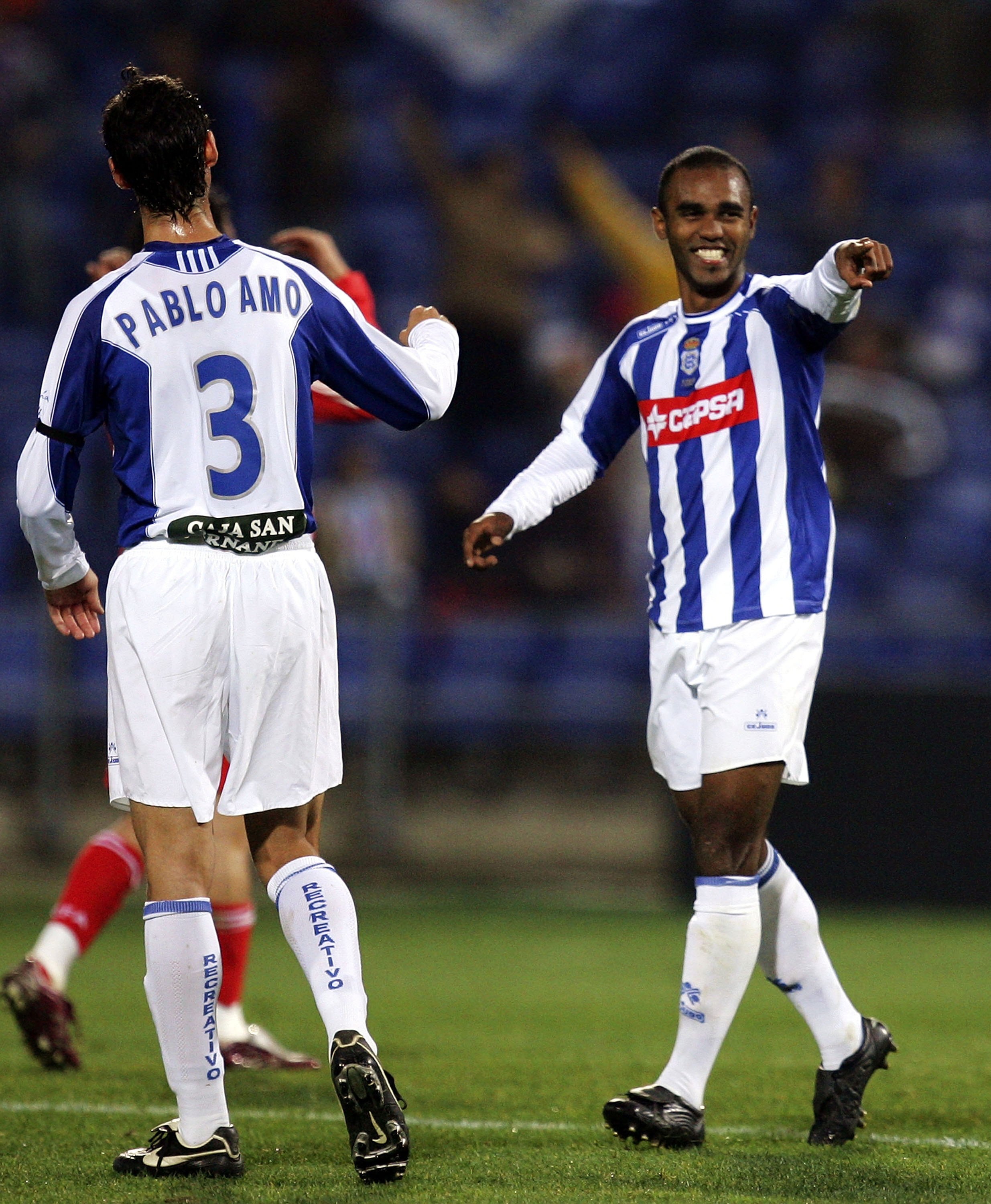 AVILA, SPAIN - JANUARY 16:  Florent Sinama Pongolle  of Recreativo Huelva celebrates after scoring a goal against China during a friendly soccer match between China and Recreativo Huelva at the Nuevo Colombino stadium on January 18, 2006, in Huelva, Spain