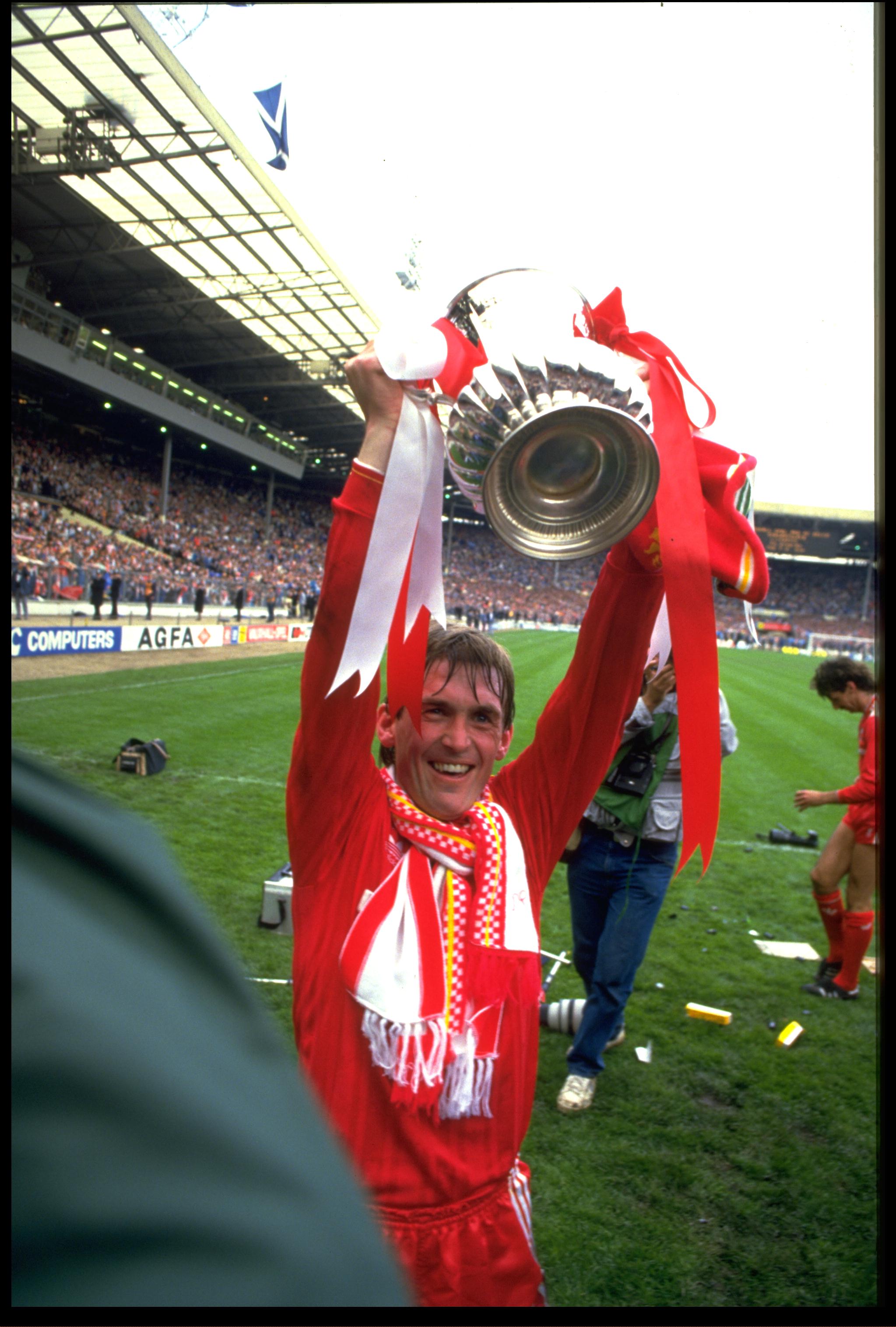 MAY 1986:  KENNY DALGLISH OF LIVERPOOL CELEBRATES WITH THE FA CUP AFTER LIVERPOOL HAD BEATEN EVERTON 3-1 IN THE FINAL AT WEMBLEY.