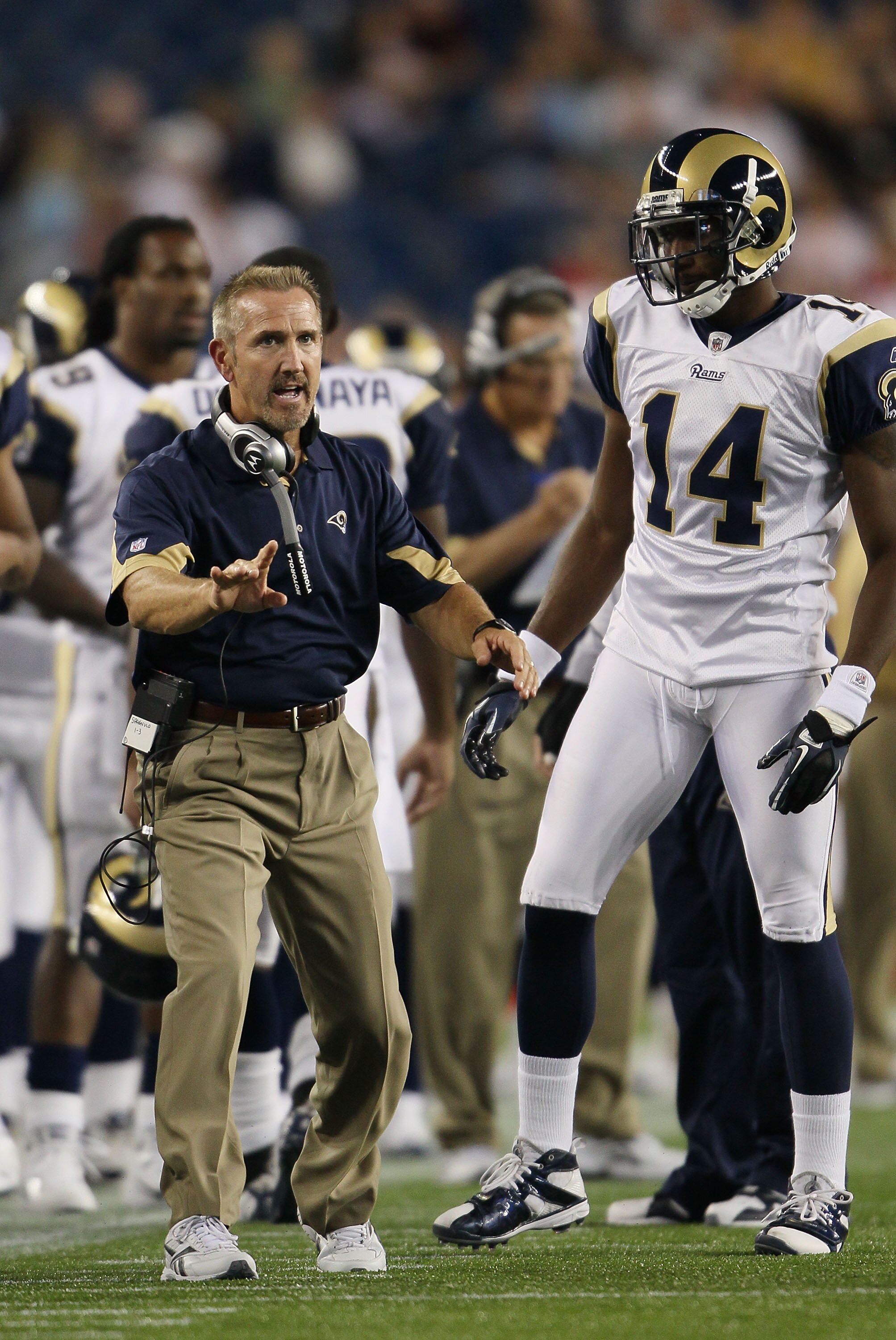 FOXBORO, MA - AUGUST 26:  Head coach Steve Spagnuolo of the St. Louis Rams talks with Keenan Burton #14 in the second half against the New England Patriots on August 26, 2010 at Gillette Stadium in Foxboro, Massachusetts. The Rams defeated the Patriots 36