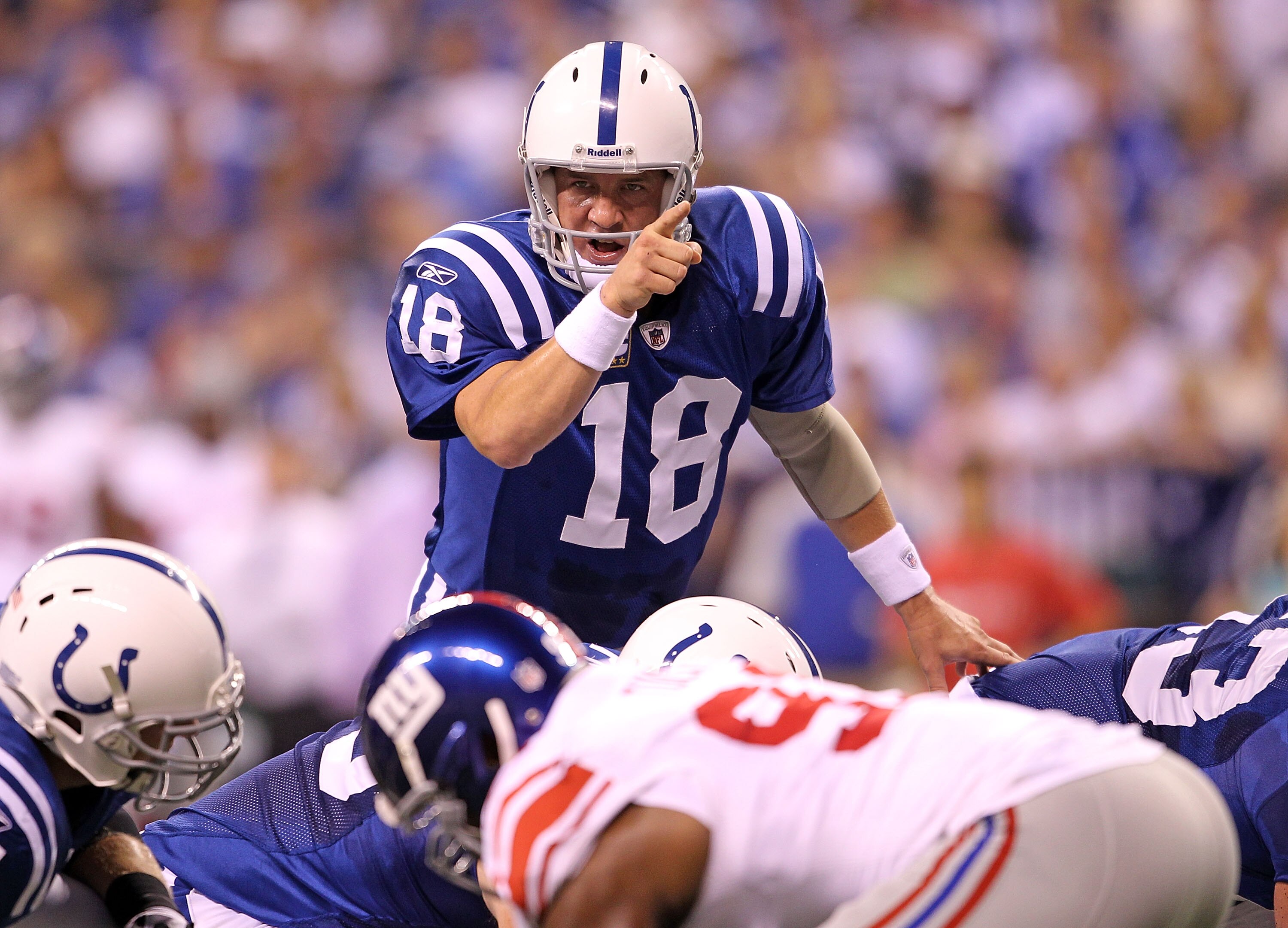 INDIANAPOLIS - SEPTEMBER 19:  Peyton Manning #18 of the Indianapolis Colts gives instructions to his team during  the NFL game against the New York Giants  at Lucas Oil Stadium on September 19, 2010 in Indianapolis, Indiana.  (Photo by Andy Lyons/Getty Im