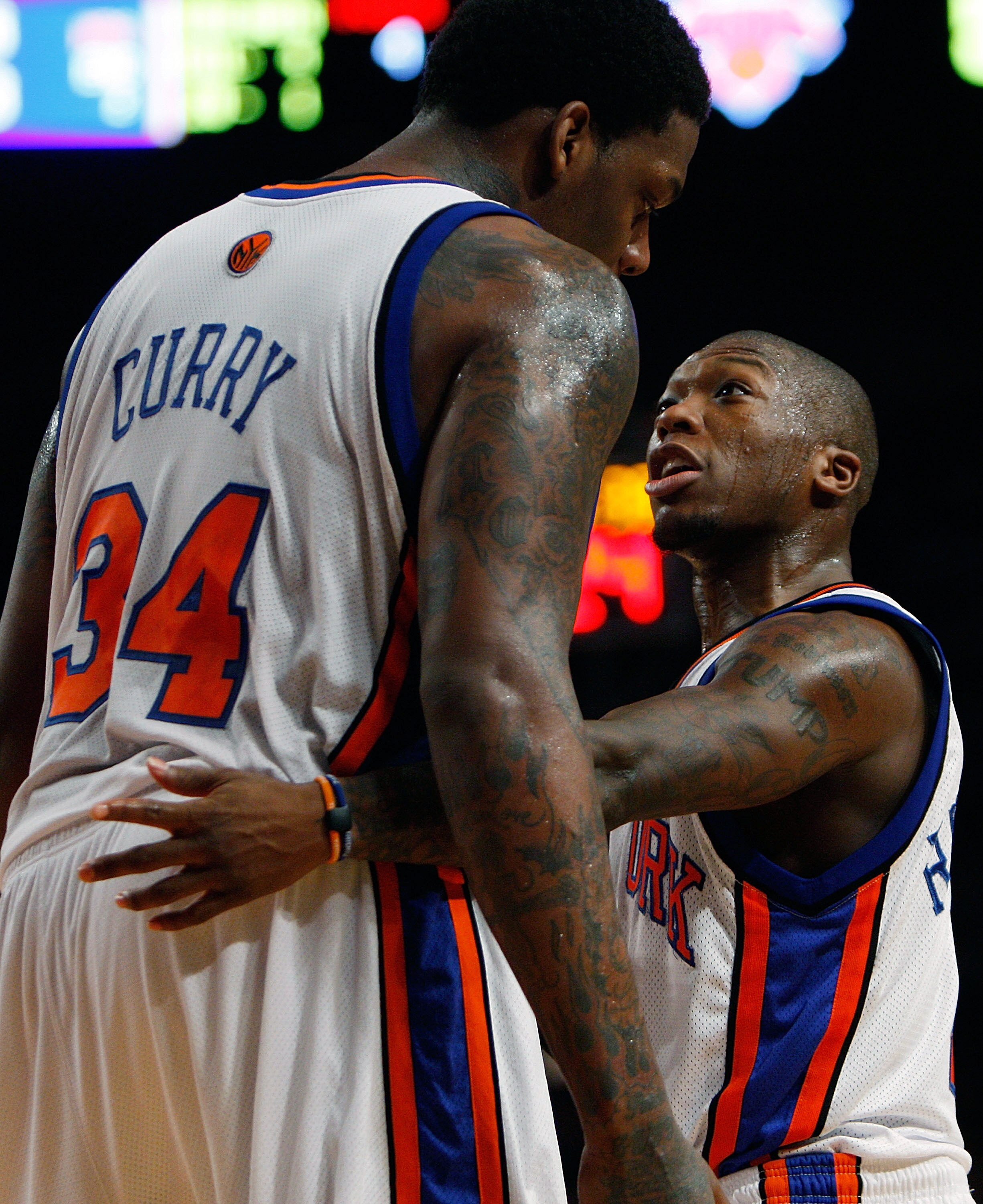 NEW YORK - MARCH 07:  Eddy Curry #34 of the New York Knicks talks to teammate Nate Robinson #4 against the Detroit Pistons on March 7, 2008 at Madison Square Garden in New York City. NOTE TO USER: User expressly acknowledges and agrees that, by downloadin
