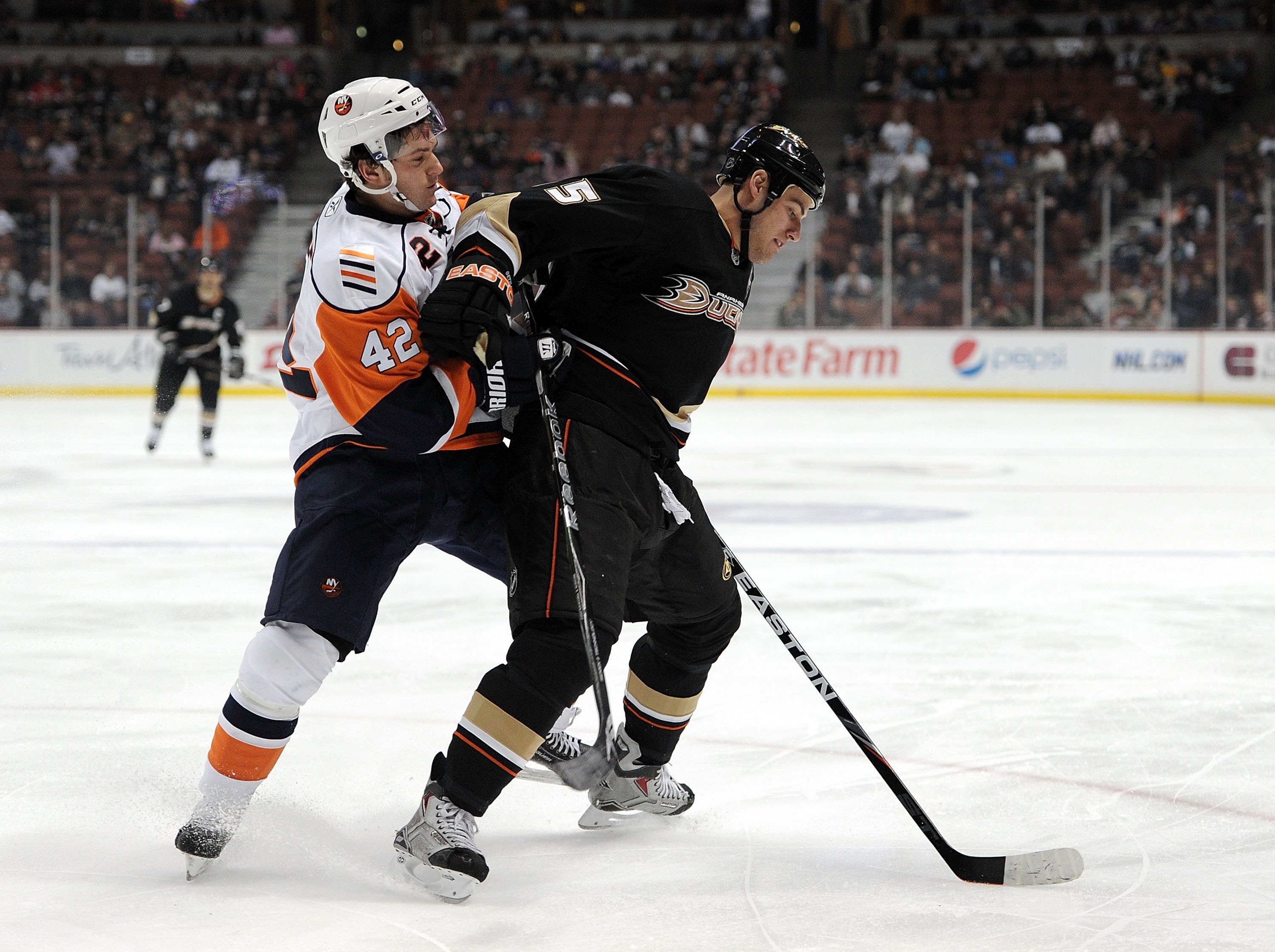 ANAHEIM, CA - MARCH 19:  Ryan Getzlaf #15 of the Anaheim Ducks fends off Dylan Reese #42 of the New York Islanders at the Honda Center on March 19, 2010 in Anaheim, California.  (Photo by Harry How/Getty Images)