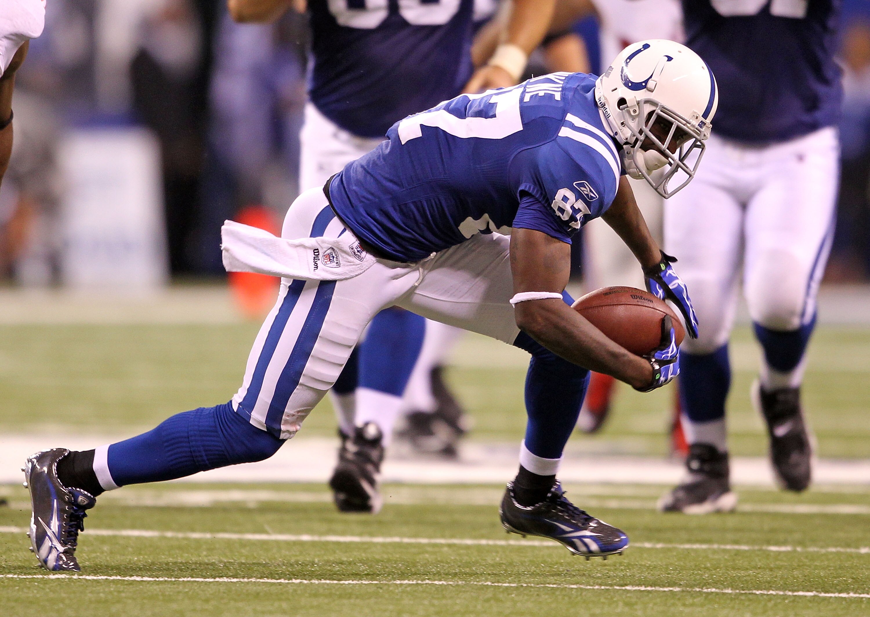 INDIANAPOLIS - SEPTEMBER 19:  Reggie Wayne #87 of the Indianapolis Colts runs with the ball during the NFL game against the New York Giants  at Lucas Oil Stadium on September 19, 2010 in Indianapolis, Indiana.  (Photo by Andy Lyons/Getty Images)