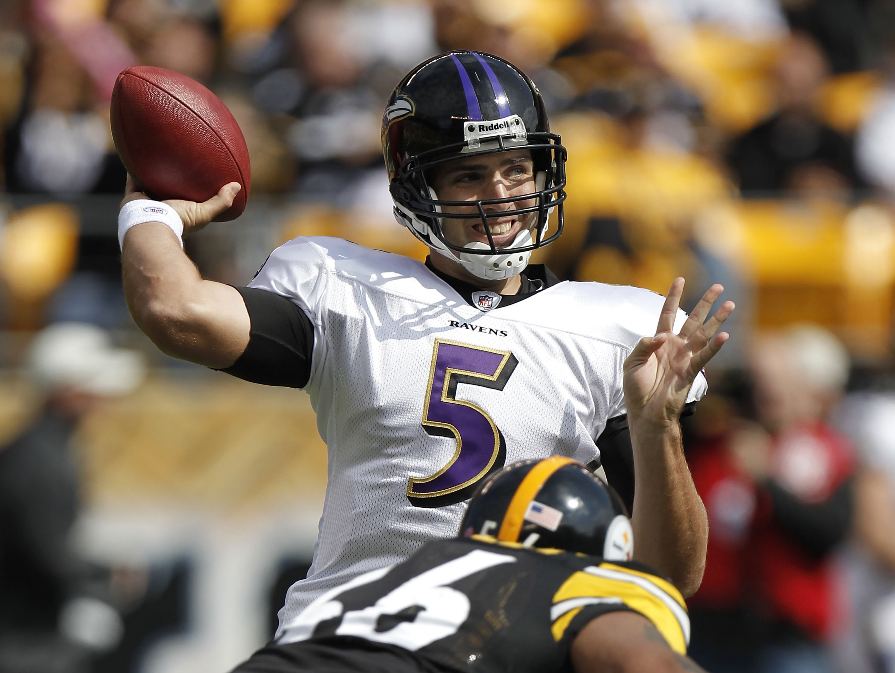 PITTSBURGH - OCTOBER 03: Joe Flacco #5 of the Baltimore Ravens throws a pass behind LaMarr Woodley #56 of the Pittsburgh Steelers on October 3, 2010 at Heinz Field in Pittsburgh, Pennsylvania. Baltimore won the game 17-14. (Photo by Gregory Shamus/Getty I