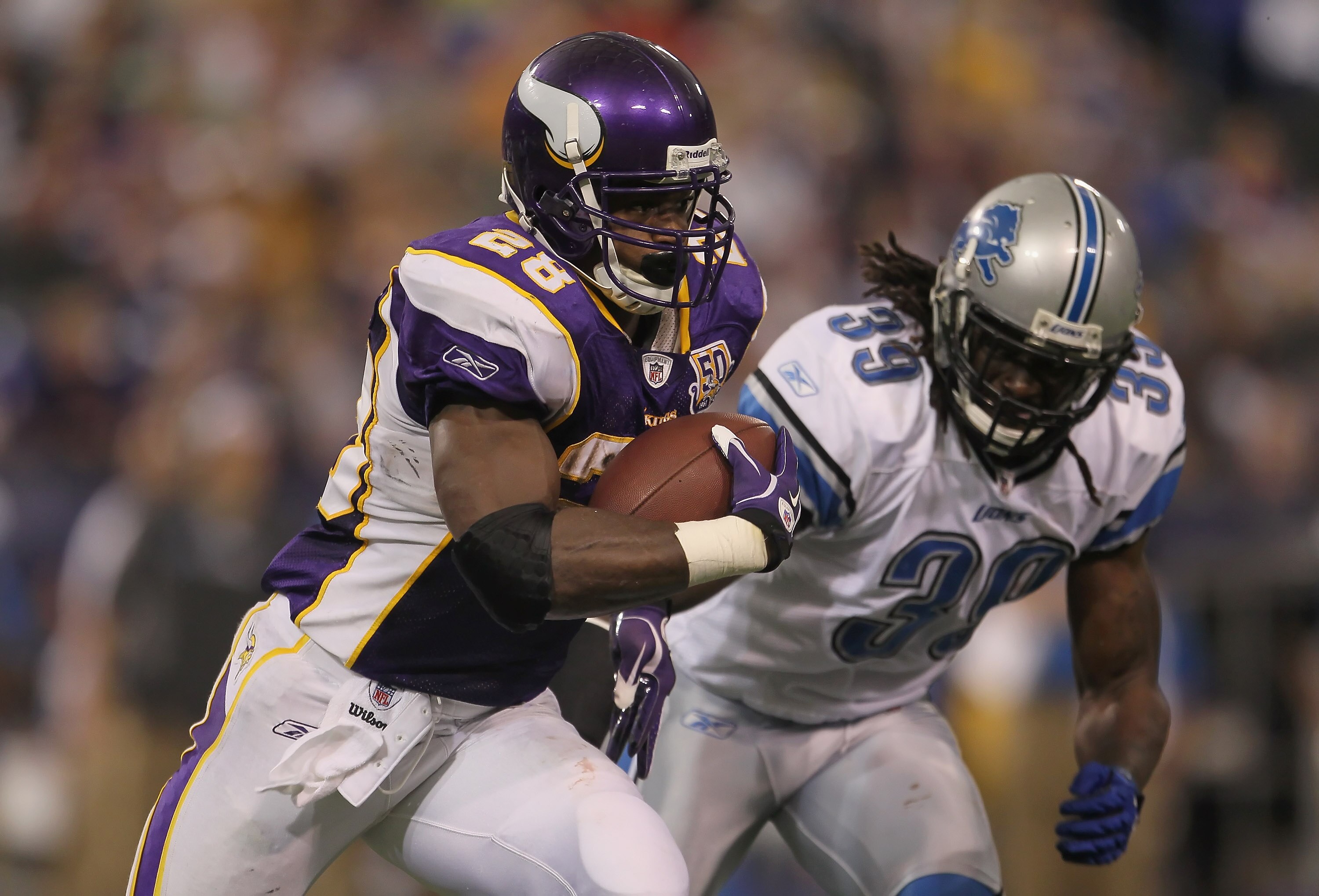 MINNEAPOLIS - SEPTEMBER 26:  Running back Adrian Peterson #28 of the Minnesota Vikings carries the ball around C.C. Brown #39 of the Detroit Lions for a touchdown during the second half at Hubert H. Humphrey Metrodome on September 26, 2010 in Minneapolis,