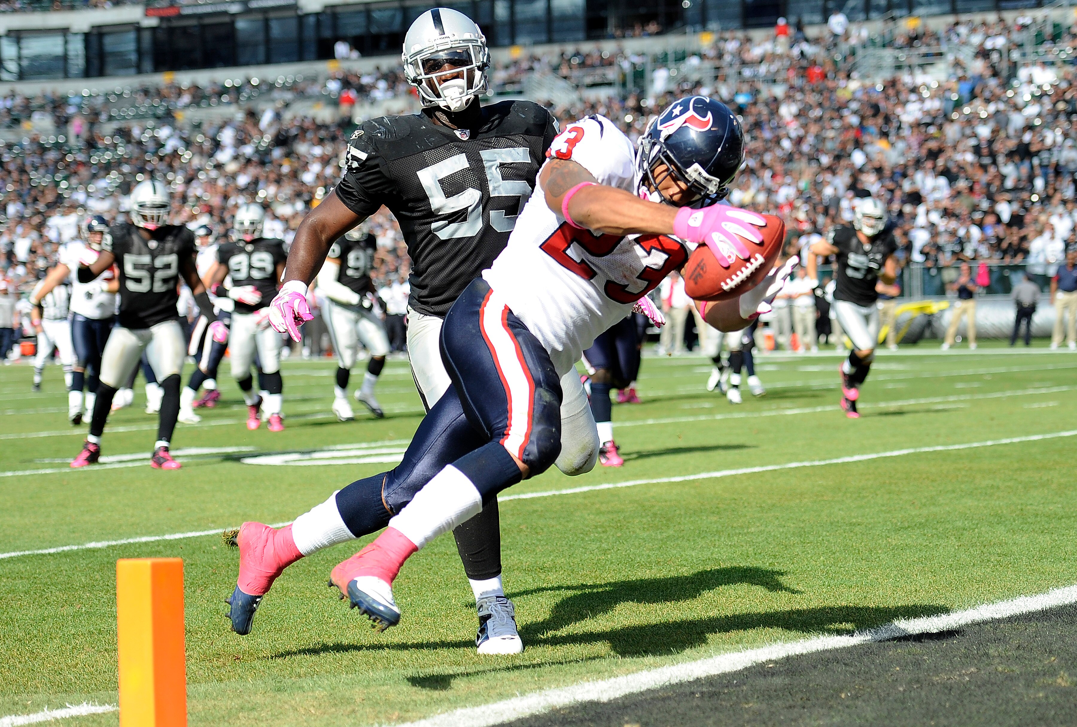 OAKLAND, CA - OCTOBER 3:  Running back Arian Foster #23 of the Houston Texans scores a touchdown in front of linebacker Rolando McClain #55 of the Oakland Raiders  during an NFL football game October 3, 2010 at The Oakland-Alameda County Coliseum in Oakla