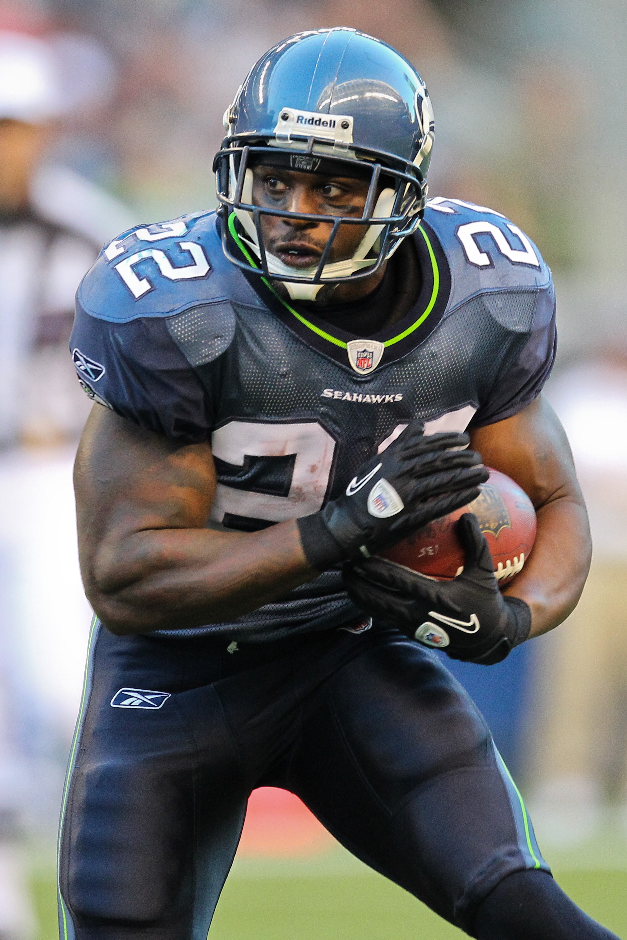 SEATTLE - AUGUST 14:  Running back Julius Jones #22 of the Seattle Seahawks rushes during the preseason game against the Tennessee Titans at Qwest Field on August 14, 2010 in Seattle, Washington. (Photo by Otto Greule Jr/Getty Images)