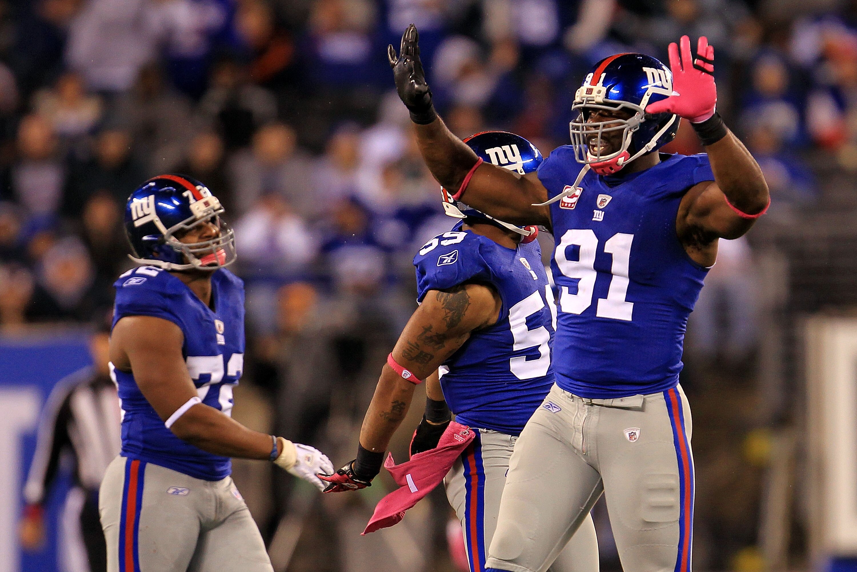 EAST RUTHERFORD, NJ - OCTOBER 03:  Justin Tuck #91 of the New York Giants celebrates after the tenth sack of the game against the Chicago Bear at New Meadowlands Stadium on October 3, 2010 in East Rutherford, New Jersey.  (Photo by Chris McGrath/Getty Ima