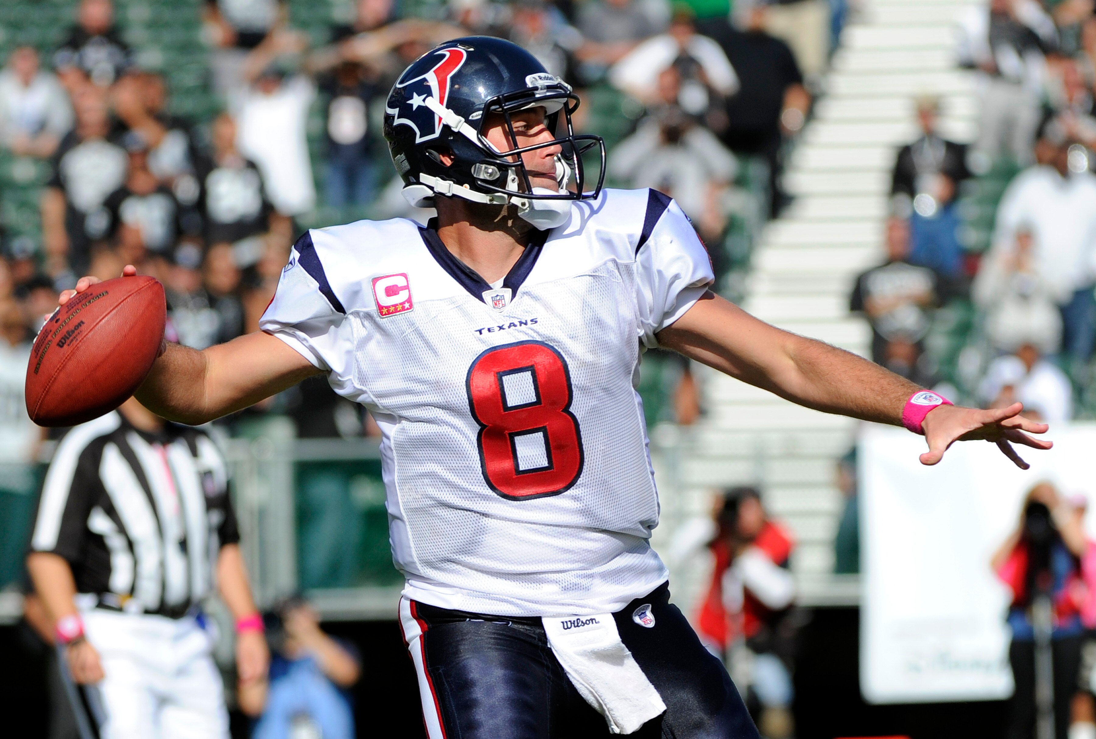 OAKLAND, CA - OCTOBER 3:  Quarterback Matt Schaub #8 of the Houston Texans rolls out to pass against the Oakland Raiders during an NFL football game October 3, 2010 at The Oakland-Alameda County Coliseum in Oakland, California.  The Texans won the game 31