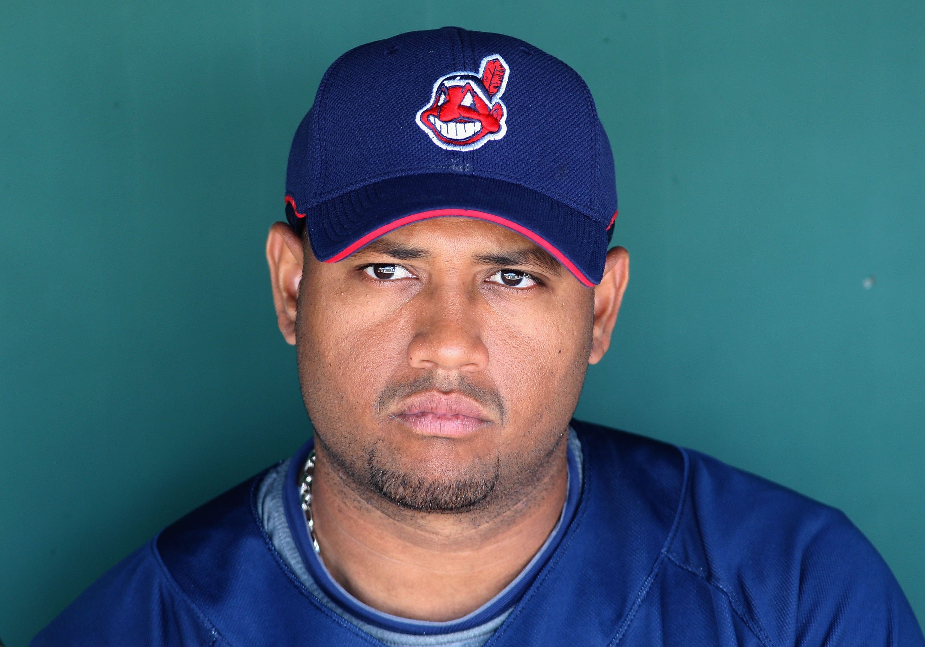 GOODYEAR , AZ - MARCH 06:  Andy Marte #15 of the Cleveland Indians looks on from the dugout during the spring training game against the Milwaukee Brewers at Goodyear Ballpark on March 6, 2009 in Goodyear, Arizona. The Brewers defeated the Indians 17-7.  (