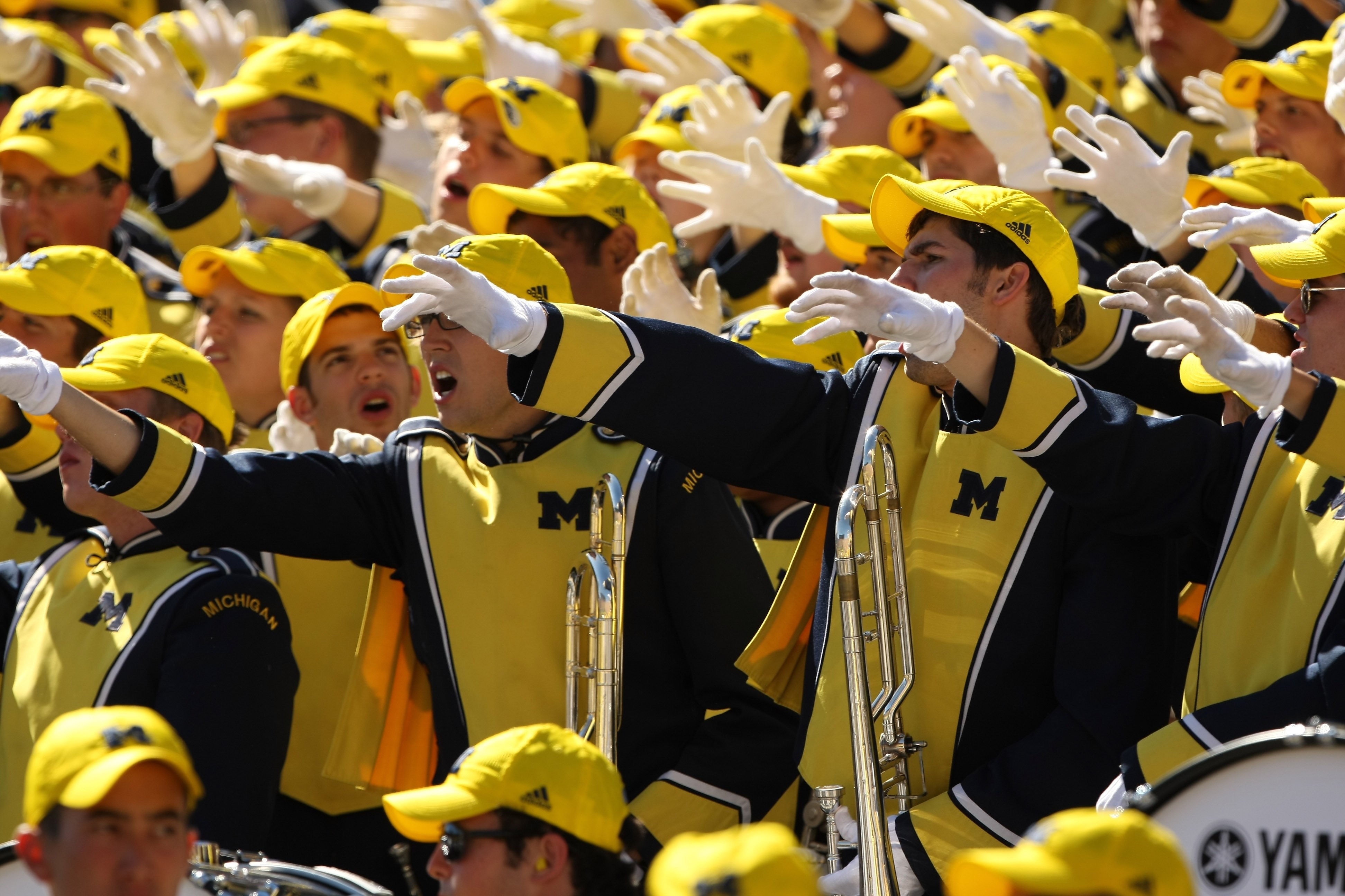 ANN ARBOR, MI - SEPTEMBER 19:  Members of the Michigan Wolverines band cheer in the game against the Eastern Michigan Eagles at Michigan Stadium on September 19, 2009 in Ann Arbor, Michigan. Michigan won 45-17.  (Photo by Stephen Dunn/Getty Images)