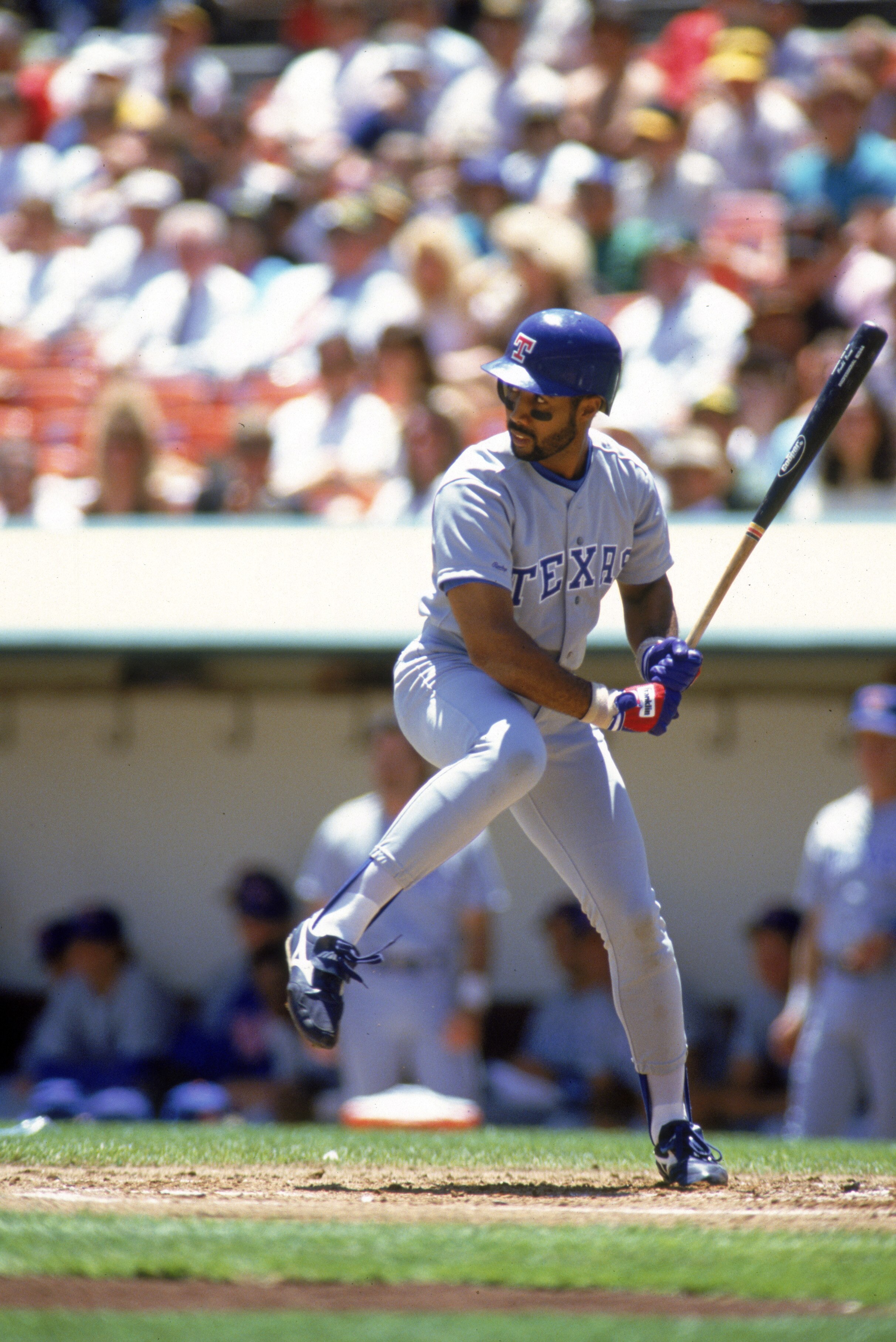 OAKLAND, CA - 1990:  Harold Baines #3 of the Texas Rangers steps into the swing during a 1990 season game against the Oakland Athletics at Oakland-Alameda County Coliseum in Oakland, California. (Photo by Otto Greule Jr/Getty Images)