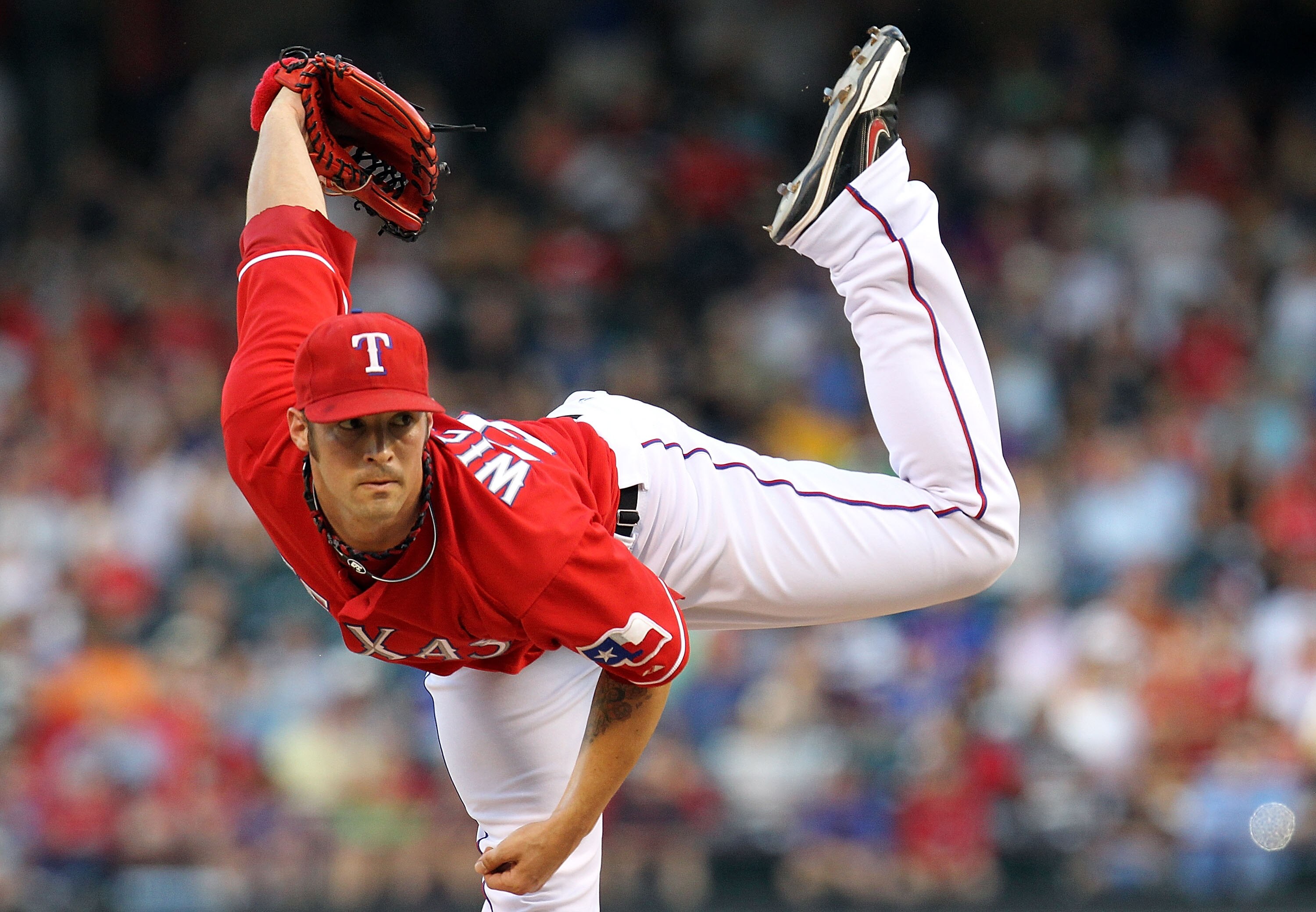 ARLINGTON, TX - JULY 29:  C.J. Wilson #36 of the Texas Rangers throws against the Oakland Athletics on July 29, 2010 at Rangers Ballpark in Arlington, Texas.  (Photo by Ronald Martinez/Getty Images)