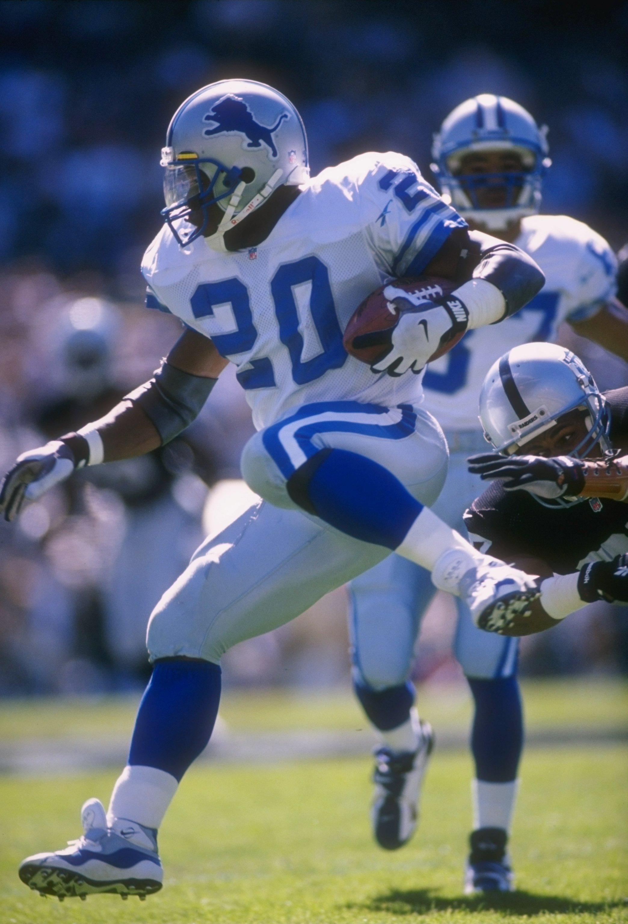 13 Oct 1996: Running back Barry Sanders #20 of the Detroit Lions keeps his eyes focused up field as he jumps over a would be tackler from the Oakland Raiders while running with the football during a carry in the Lions 37-21 loss to the Raiders at Alameda