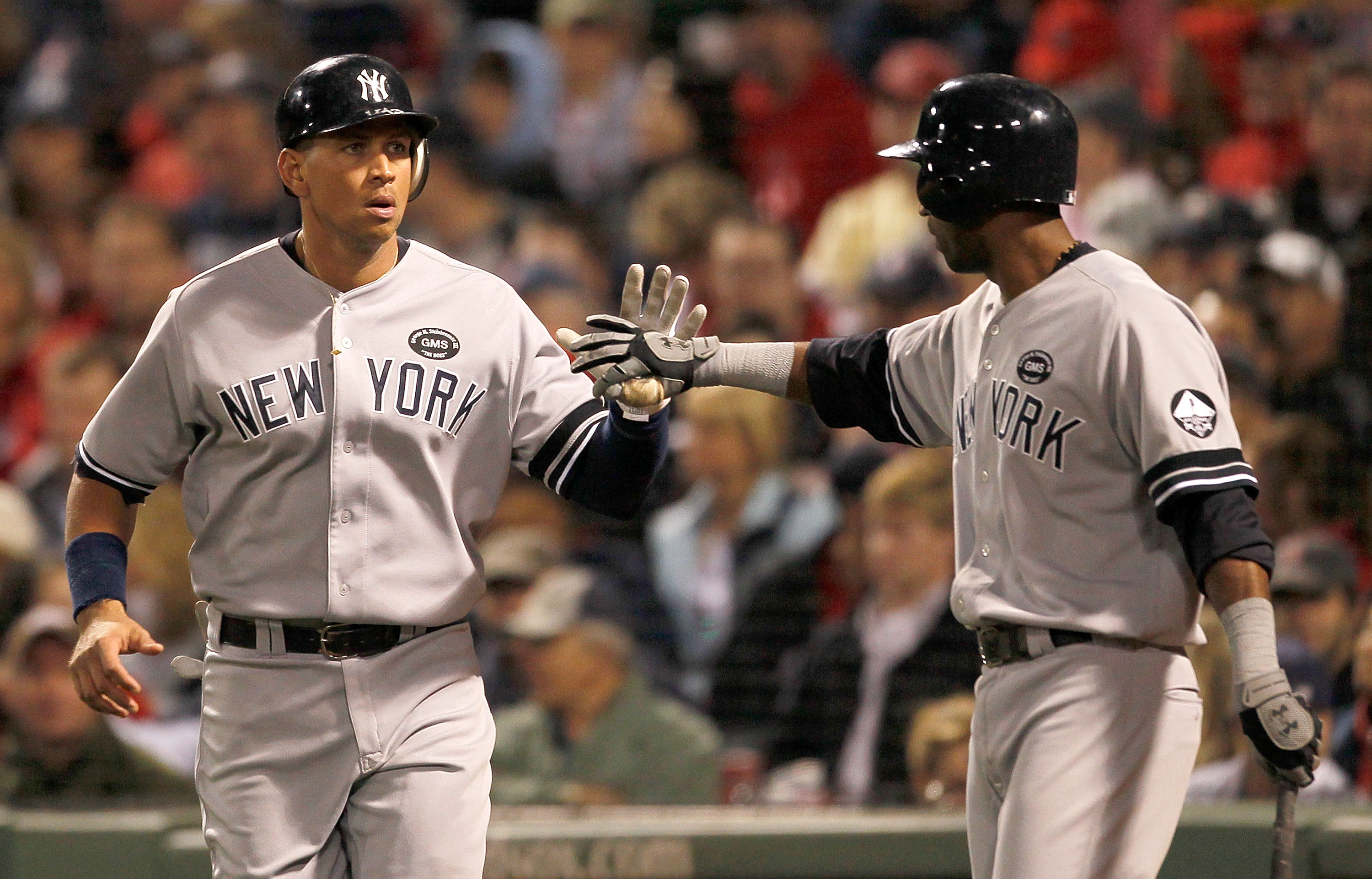 BOSTON - OCTOBER 2:  Alex Rodriguez #13 of the New York Yankees celebrates with teammate Eduardo Nunez #12 after Rodriguez scored against the Boston Red Sox in the second game of a doubleheader at Fenway Park, October 2, 2010, in Boston, Massachusetts. (P