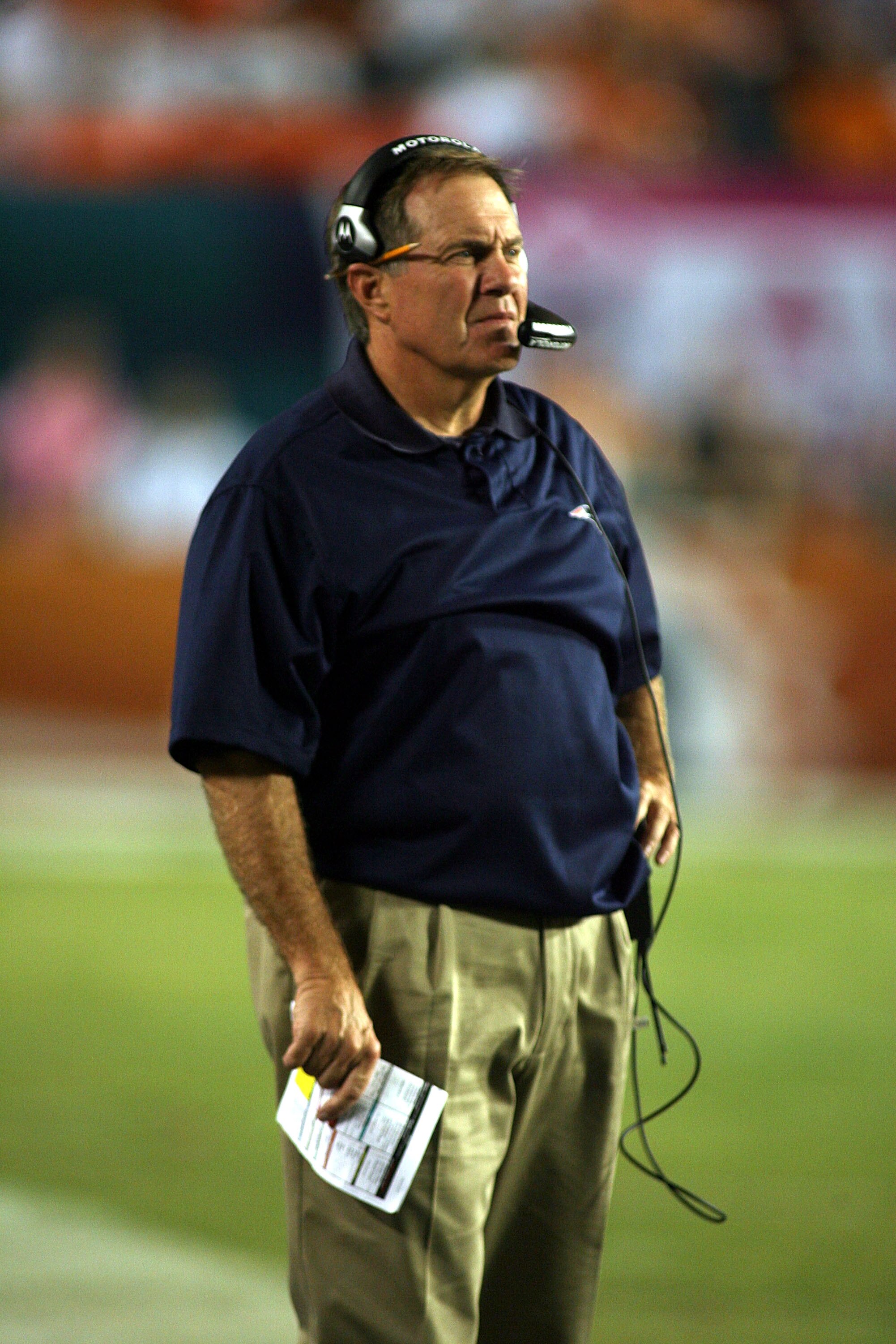 MIAMI - OCTOBER 04: Coach Bill Belichick of the New England Patriots stands on the sidelines against the Miami Dolphins at Sun Life Stadium on October 4, 2010 in Miami, Florida.  (Photo by Marc Serota/Getty Images)
