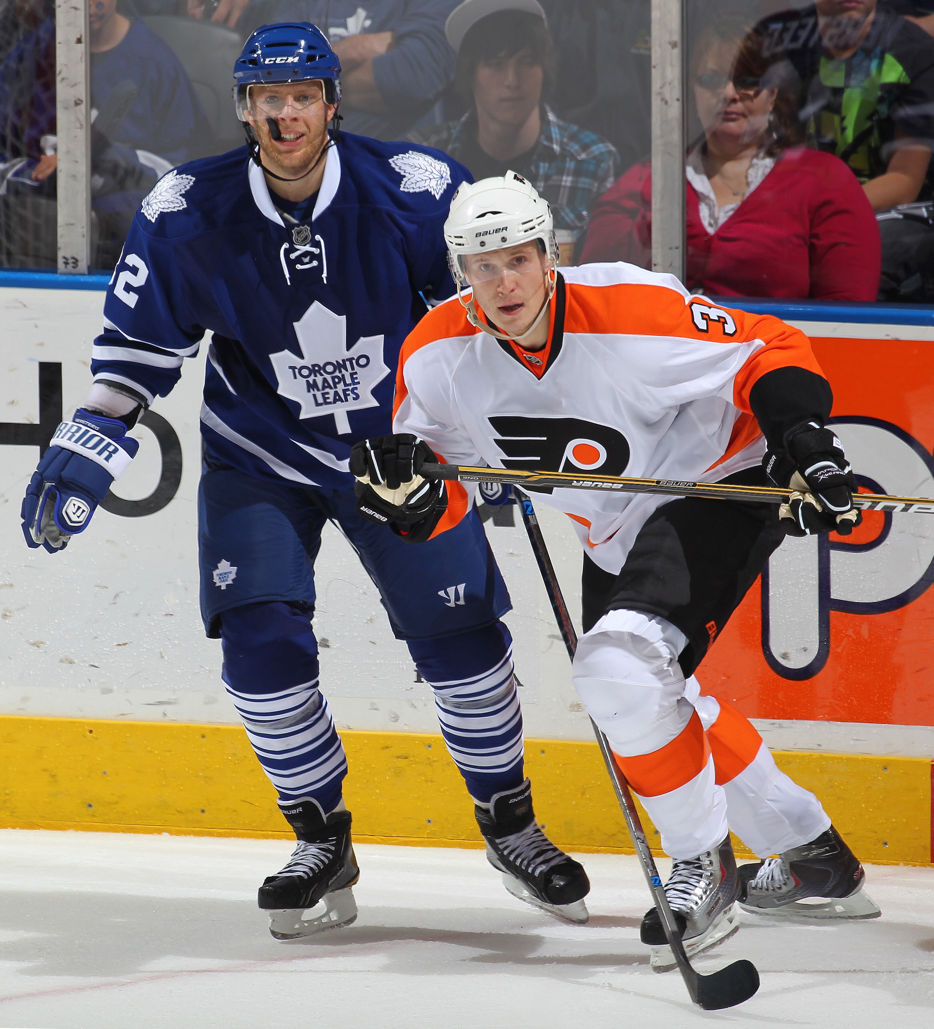 LONDON, CANADA - SEPTEMBER 23:  Kris Versteeg #32 of the Toronto Maple Leafs reacts after being hit by Oskars Bartulis #3 of the Philadelphia Flyers in a preseason game on September 23,2010 at the John Labatt Centre in London, Ontario. The Leafs defeated