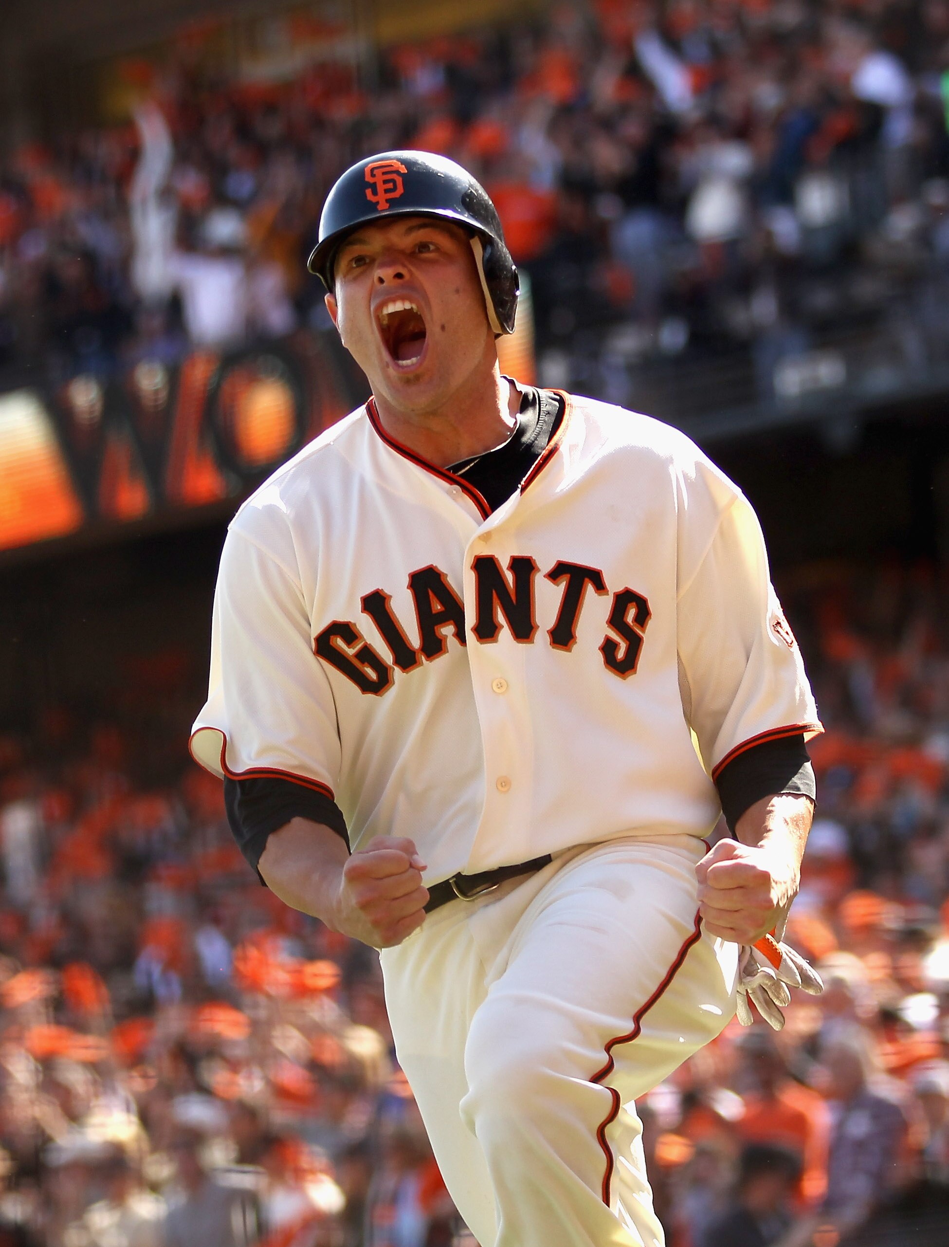 SAN FRANCISCO - OCTOBER 03:  Freddy Sanchez #21 of the San Francisco Giants celebrates after he scored on a double to give the Giants a 2-0 lead in the third inning of their game against the San Diego Padres at AT&T Park on October 3, 2010 in San Francisc