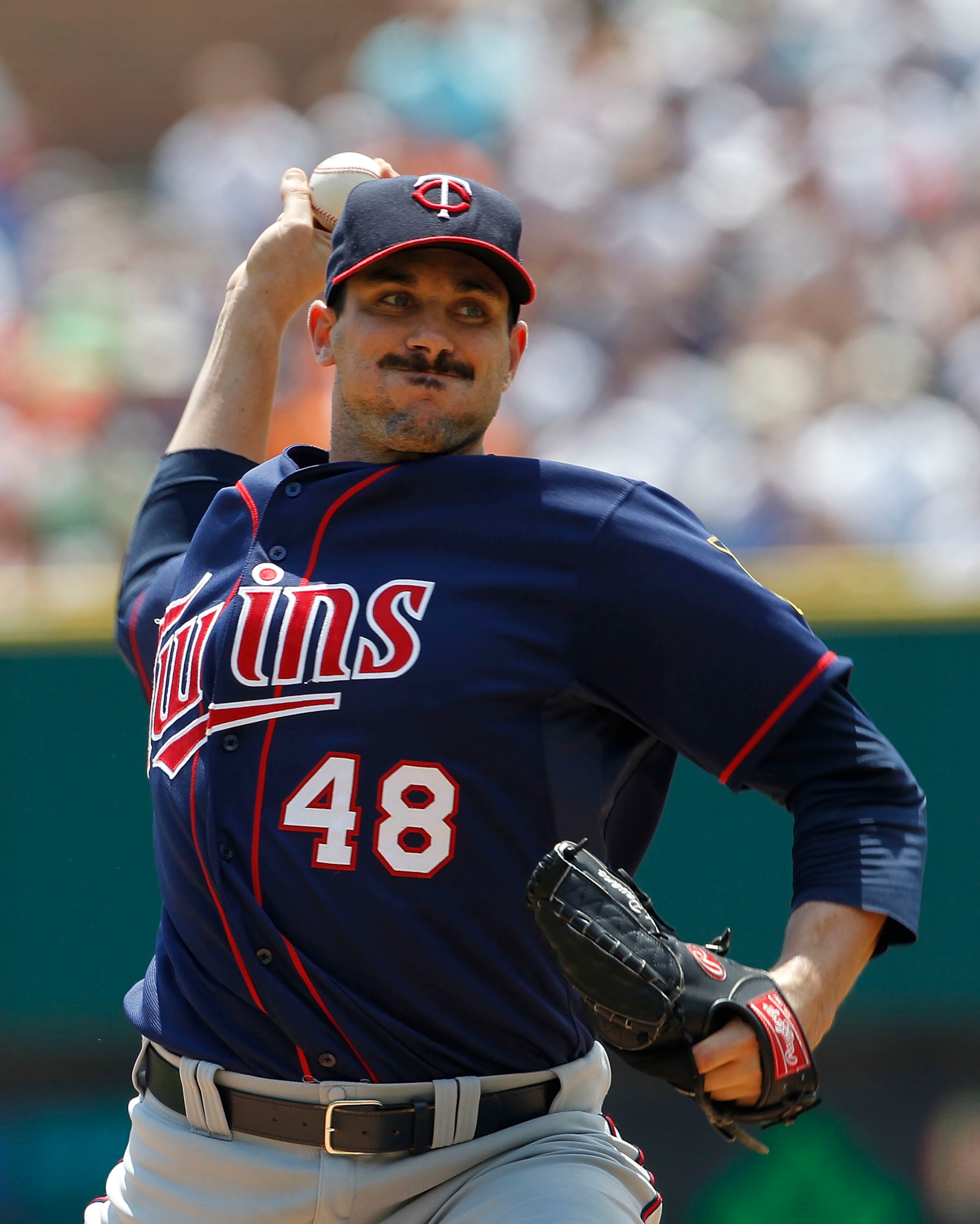 DETROIT - JULY 11: Carl Pavano #48 of the Minnesota Twins pitches in the first inning during the game against the Detroit Tigers on July 11, 2010 at Comerica Park in Detroit, Michigan.  (Photo by Leon Halip/Getty Images)
