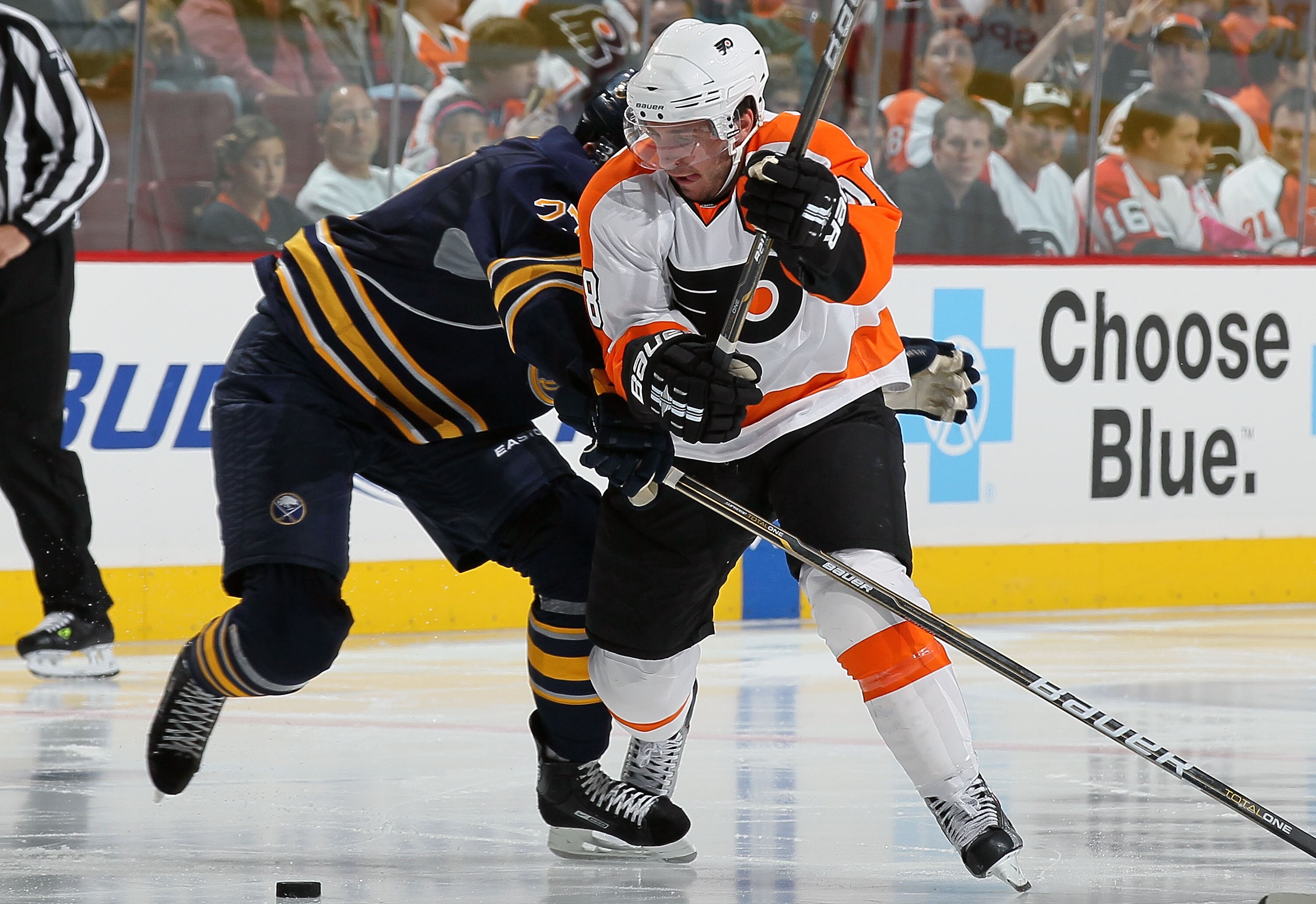 PHILADELPHIA - OCTOBER 01:  Mike Richards #18 of the Philadelphia Flyers makes a move against Shaone Morrisonn #27 of the Buffalo Sabres on October 1, 2010 at Wells Fargo Center in Philadelphia, Pennsylvania.  (Photo by Jim McIsaac/Getty Images)