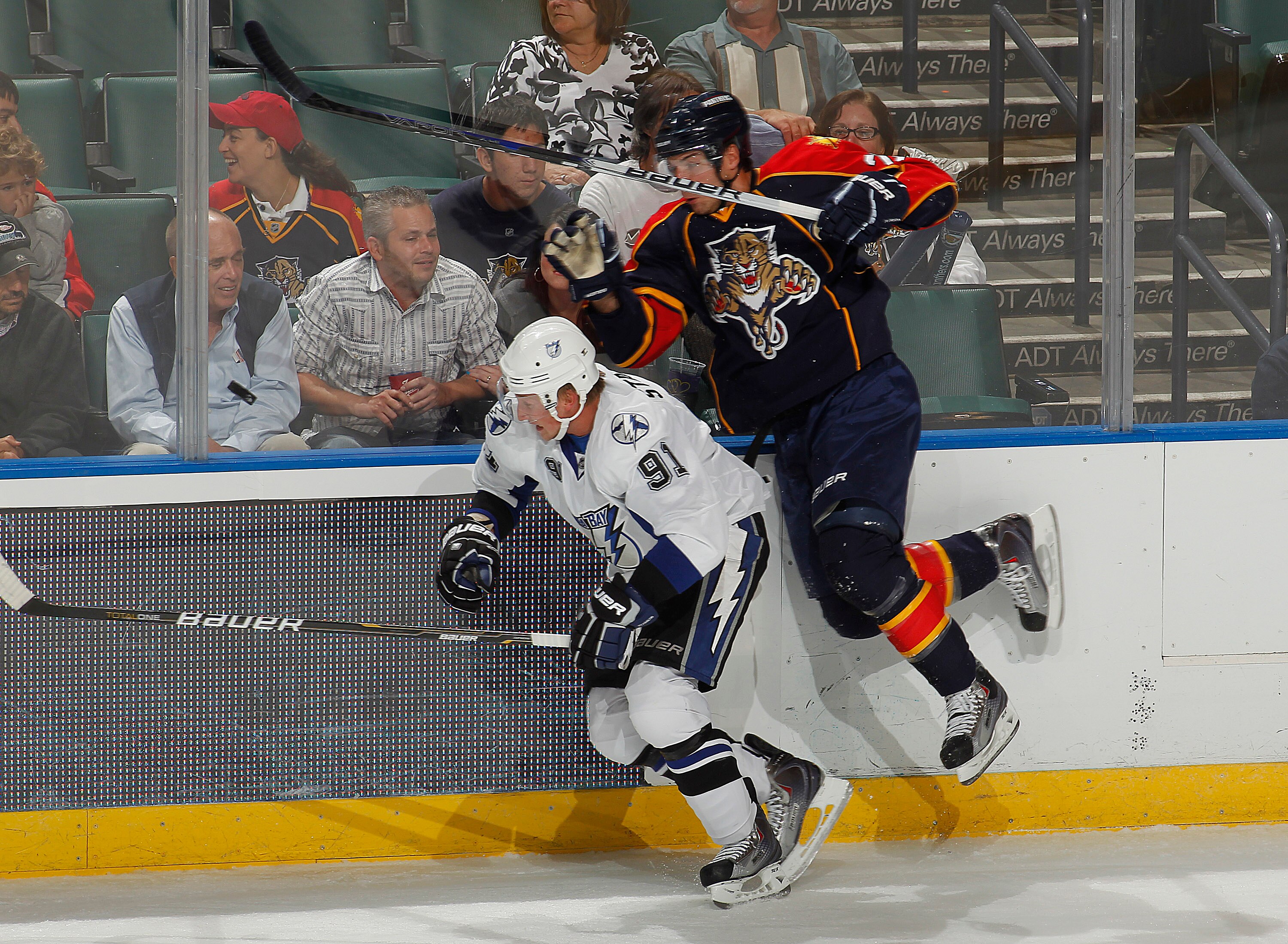 SUNRISE, FL - OCTOBER 1: Steve Bernier #26 of the Florida Panthers attempts to pass Steven Stamkos #91 of the Tampa Bay Lightning while chasing the puck during a pre season game on October 1, 2010 at the BankAtlantic Center in Sunrise, Florida. The Lightn