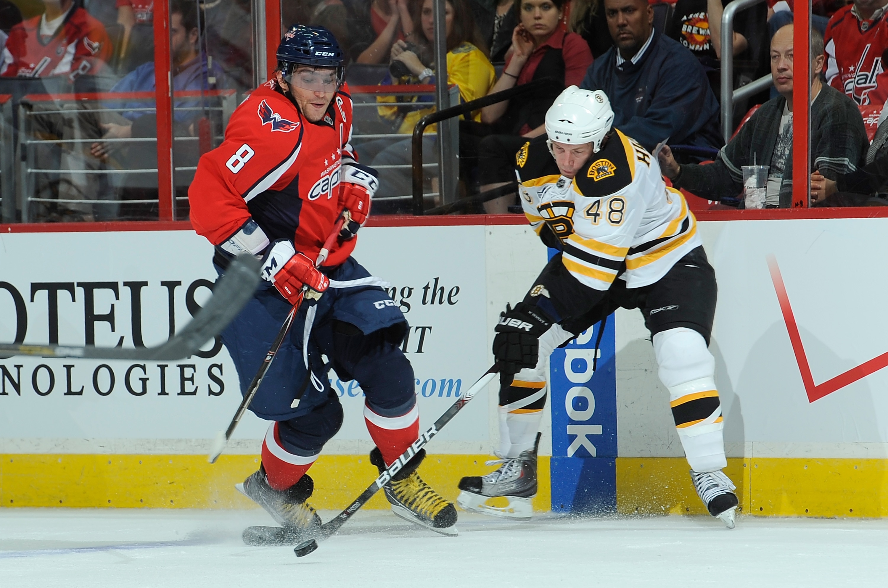 WASHINGTON - SEPTEMBER 28:  Alex Ovechkin #8 of the Washington Capitals battles for the puck with Matt Hunwick #48 of the Boston Bruins at Verizon Center on September 28, 2010 in Washington, DC.  (Photo by Greg Fiume/Getty Images)