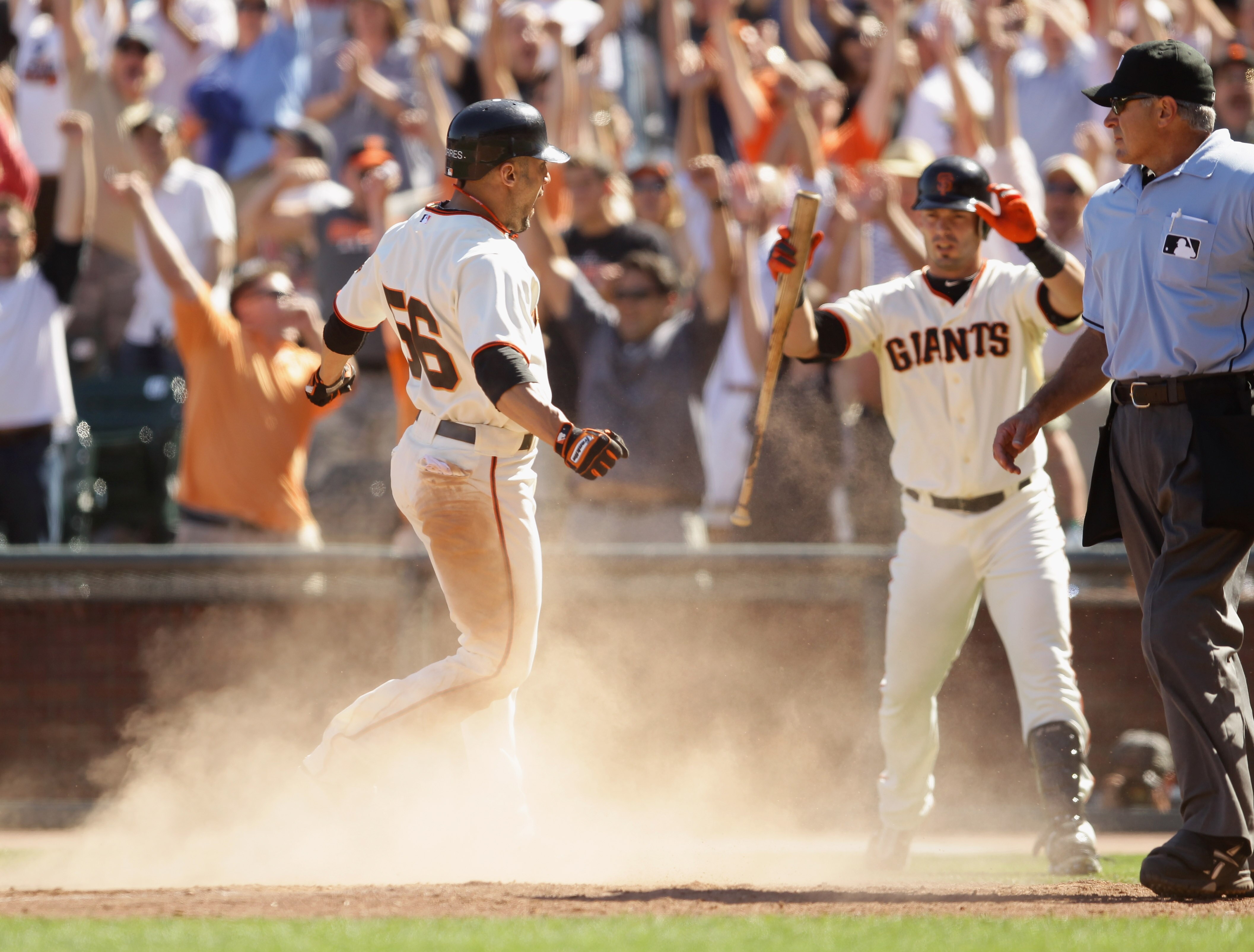SAN FRANCISCO - AUGUST 25:  Andres Torres #56 of the San Francisco Giants scores to put the Giants ahead 11-10 in the eighth inning of their game against the Cincinnati Reds at AT&T Park on August 25, 2010 in San Francisco, California.  (Photo by Ezra Sha
