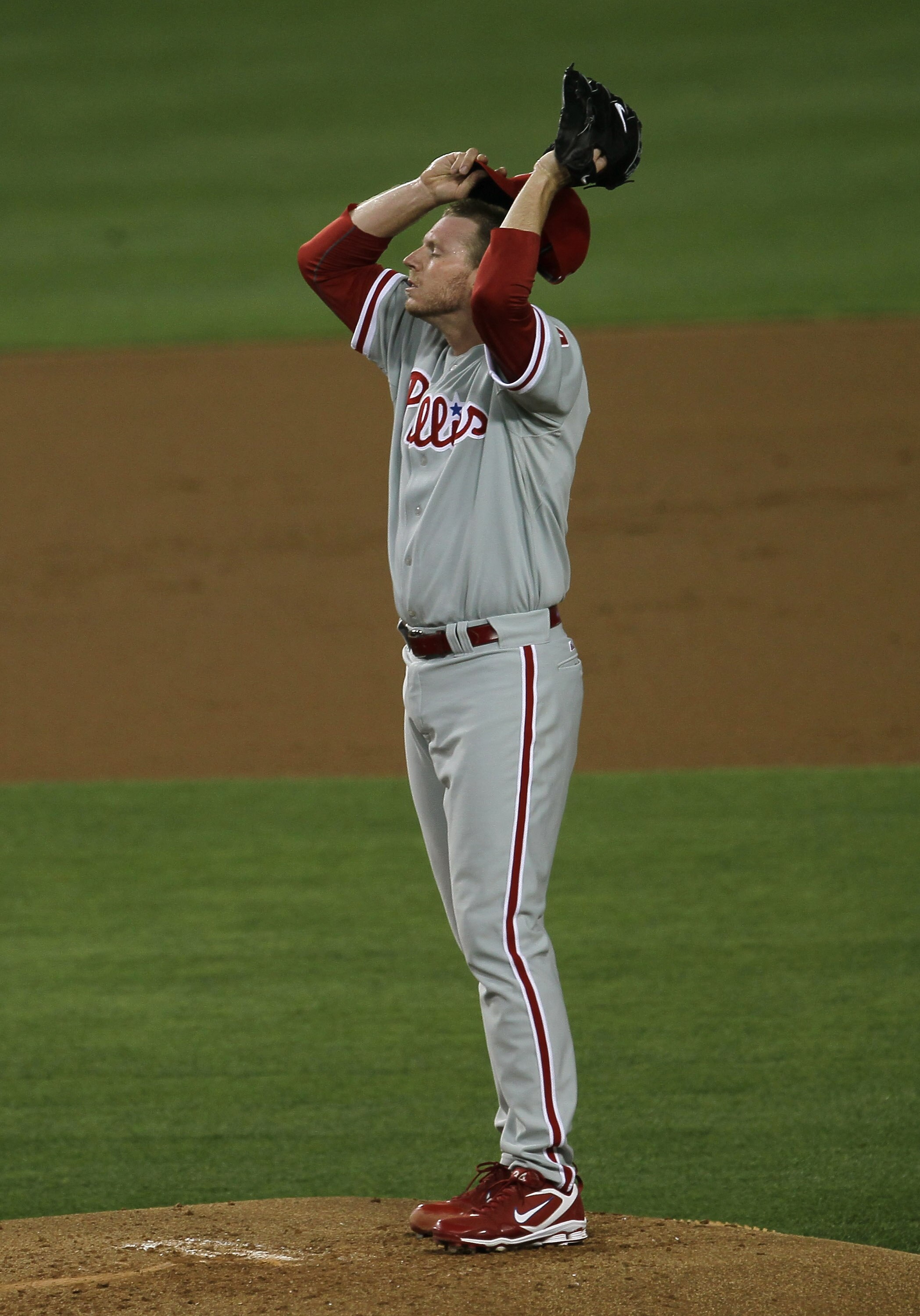 LOS ANGELES, CA - AUGUST 30:  Roy Halladay #34 of the Philadelphia Phillies reacts on the mound in the game against the Los Angeles Dodgers on August 30, 2010 at Dodger Stadium  in Los Angeles, California.  (Photo by Stephen Dunn/Getty Images)