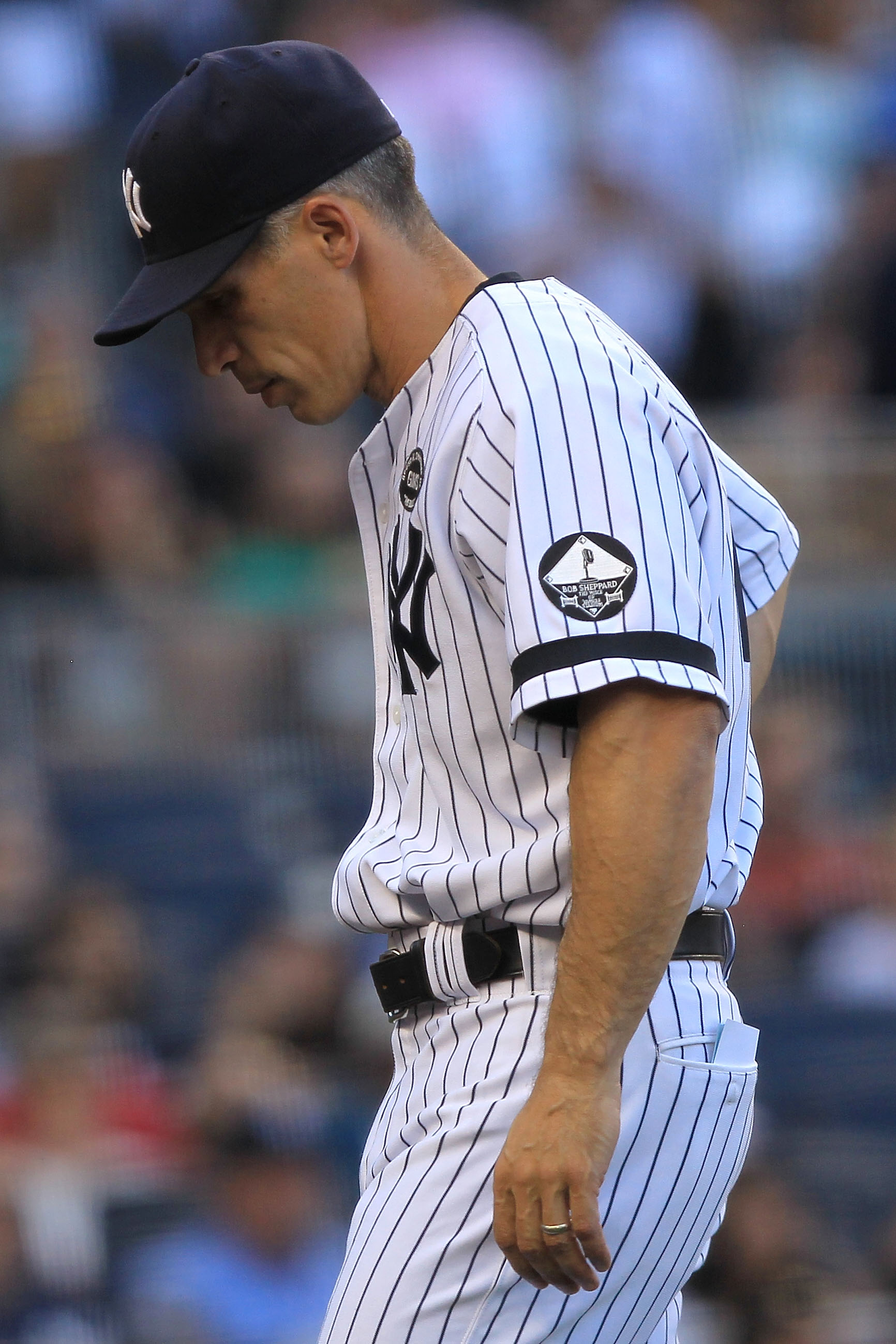 NEW YORK - SEPTEMBER 25: Manager Joe Girardi #28 of the New York Yankees walks from the field against the Boston Red Sox during their game on September 25, 2010 at Yankee Stadium in the Bronx borough of New York City.  (Photo by Chris McGrath/Getty Images