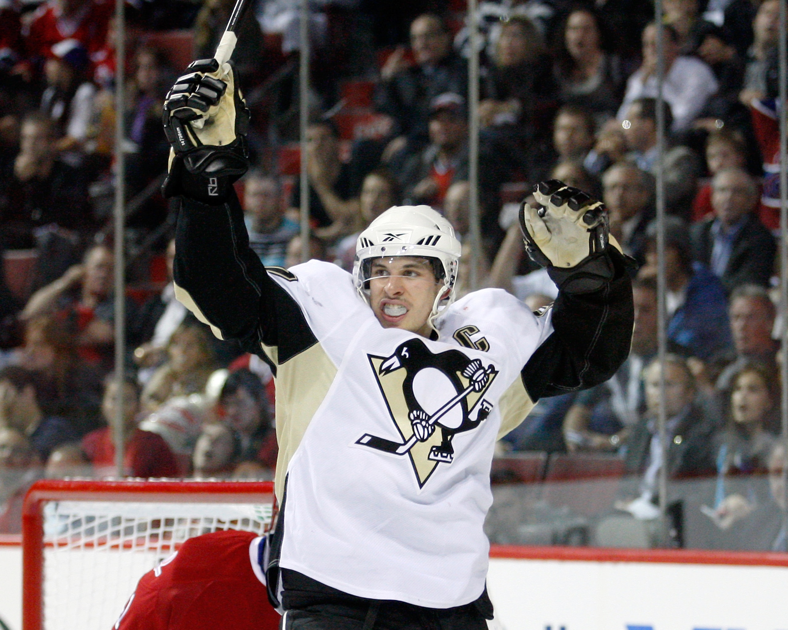 MONTREAL- MAY 4:  Sidney Crosby #87 of the Pittsburgh Penguins celebrates the third period goal by Evgeni Malkin #71 (not pictured) in Game Three of the Eastern Conference Semifinals during the 2010 NHL Stanley Cup Playoffs at the Bell Centre on May 4, 20