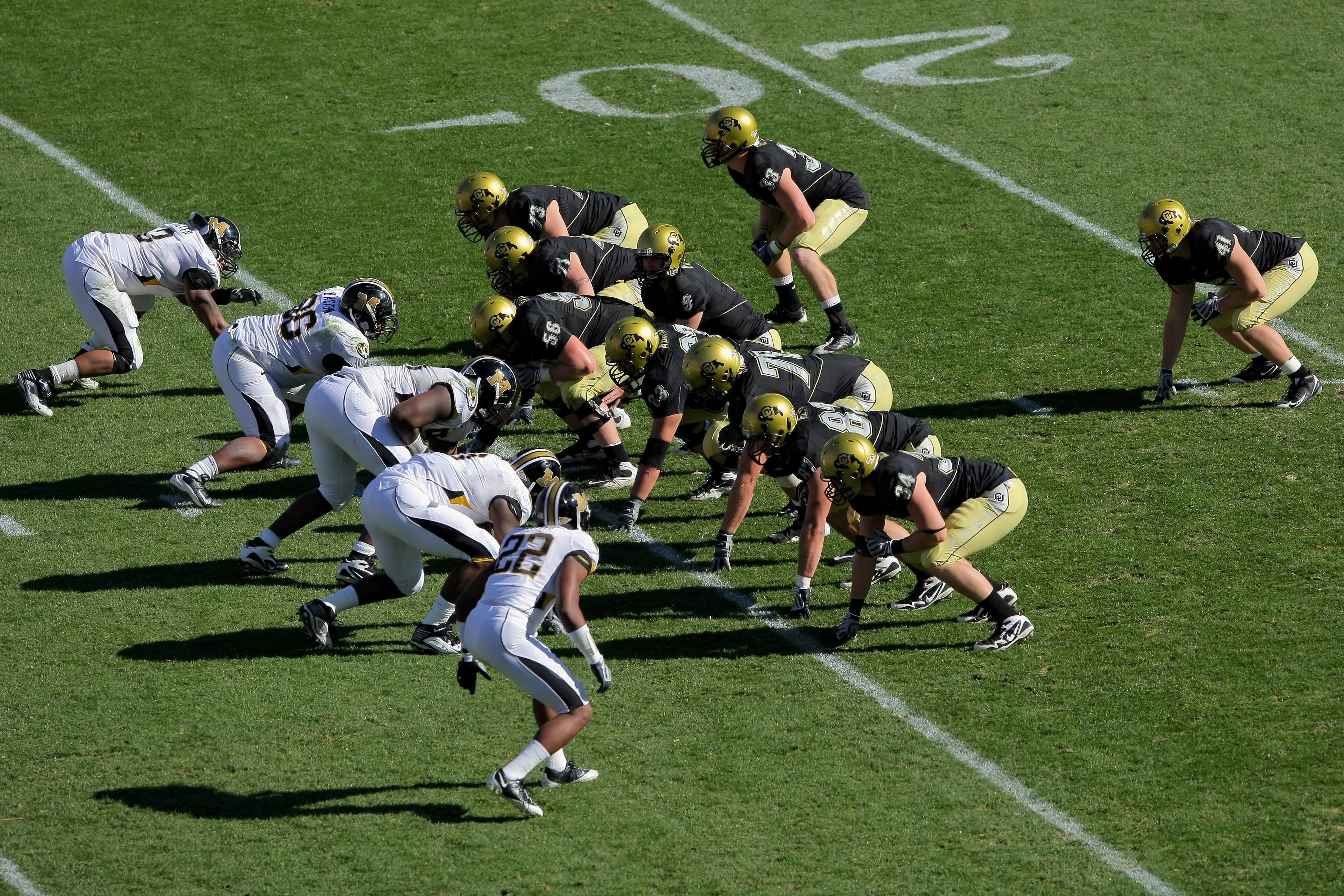 BOULDER, CO - OCTOBER 31: The Colorado Buffaloes offense lines up against the Missouri Tigers defense at Folsom Field on October 31, 2009 in Boulder, Colorado. Missouri defeated Colorado 36-17. (Photo by Doug Pensinger/Getty Images) BOULDER, CO - OCTOBER 31: The Colorado Buffaloes offense lines up against the Missouri Tigers defense at Folsom Field on October 31, 2009 in Boulder, Colorado. Missouri defeated Colorado 36-17. (Photo by Doug Pensinger/Getty Images)