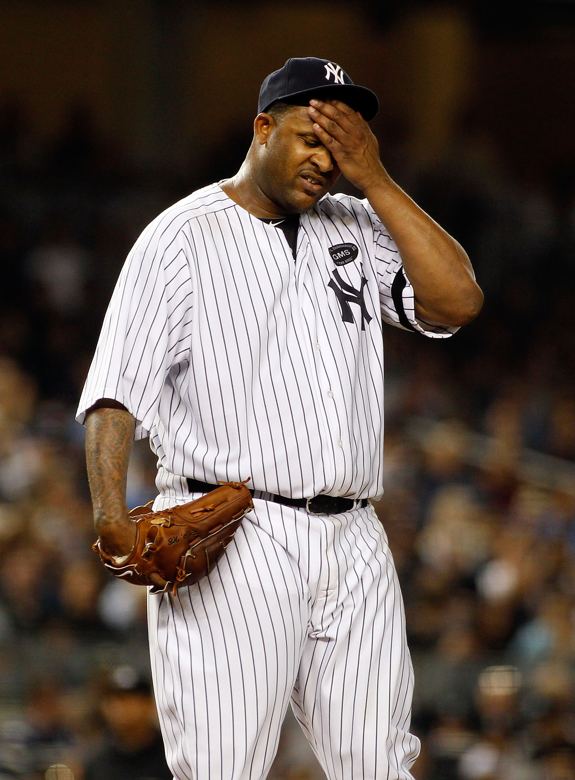 NEW YORK - SEPTEMBER 23:  CC Sabathia #52 of the New York Yankees looks on against the Tampa Bay Rays on September 23, 2010 at Yankee Stadium in the Bronx borough of New York City.  (Photo by Mike Stobe/Getty Images)