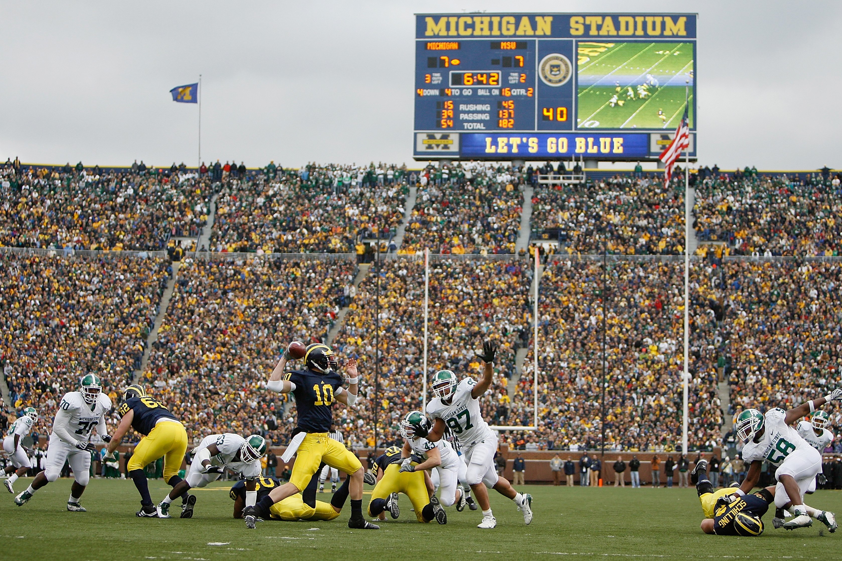 ANN ARBOR, MI - OCTOBER 25: Steven Threet #10 of the Michigan Wolverines passes the ball against Justin Kershaw #97 of the Michigan State Spartans during the game on October 25, 2008 at Michigan Stadium in Ann Arbor, Michigan. Michigan State won the game ANN ARBOR, MI - OCTOBER 25: Steven Threet #10 of the Michigan Wolverines passes the ball against Justin Kershaw #97 of the Michigan State Spartans during the game on October 25, 2008 at Michigan Stadium in Ann Arbor, Michigan. Michigan State won the game
