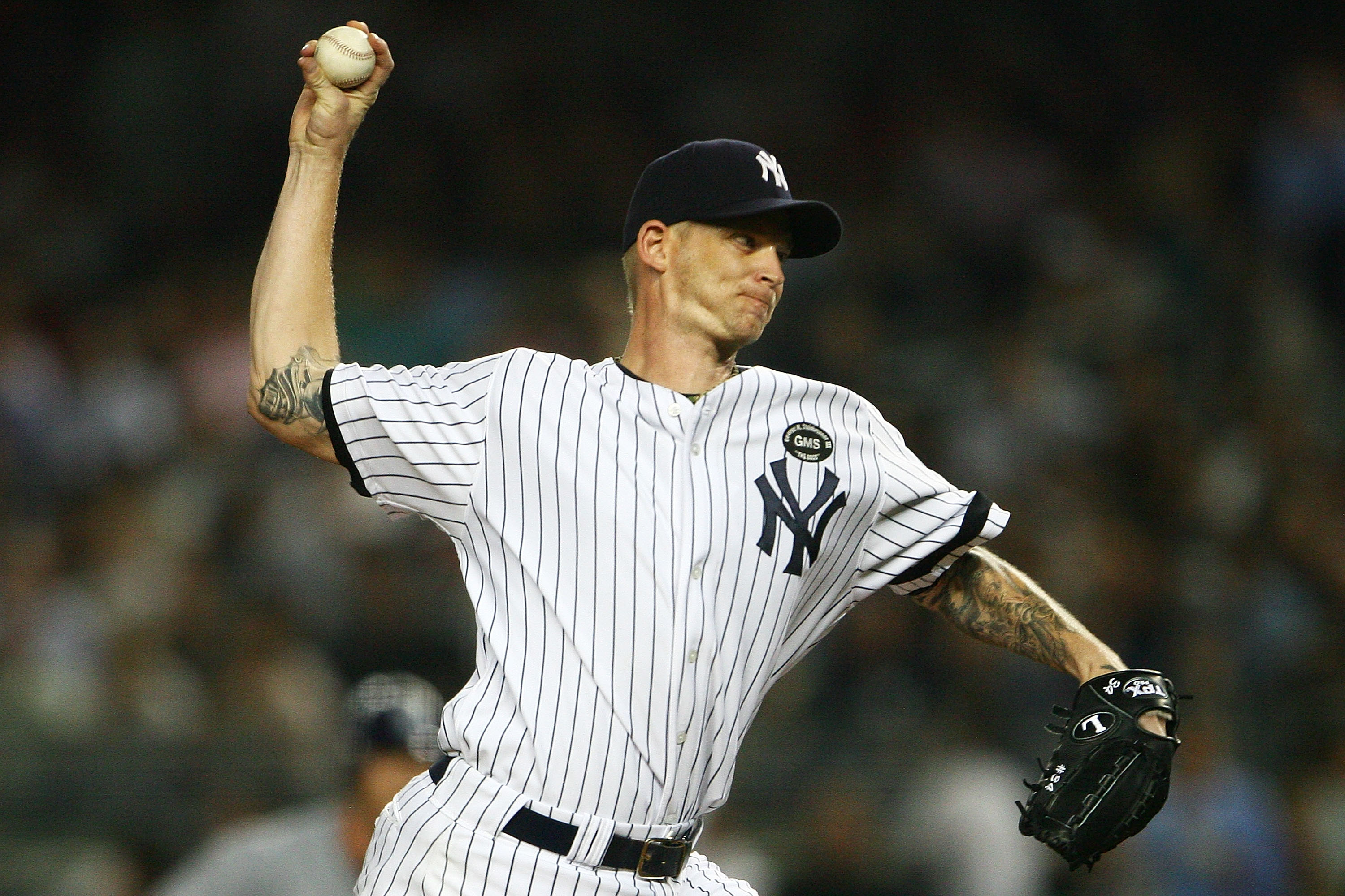 NEW YORK - SEPTEMBER 22:  A.J. Burnett #34 of the New York Yankees pitches against the Tampa Bay Rays on September 22, 2010 at Yankee Stadium in the Bronx borough of New York City.  (Photo by Andrew Burton/Getty Images)