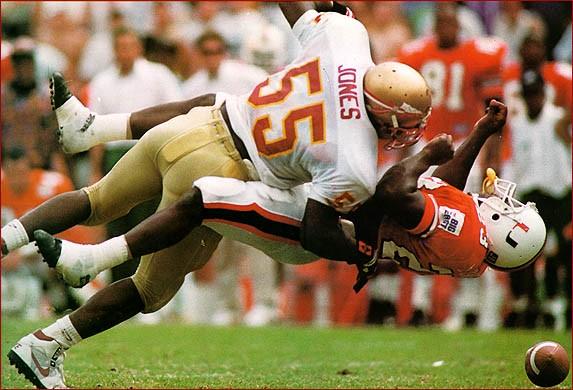 Marvin Jones introduces himself to a dizzy Miami ball carrier.