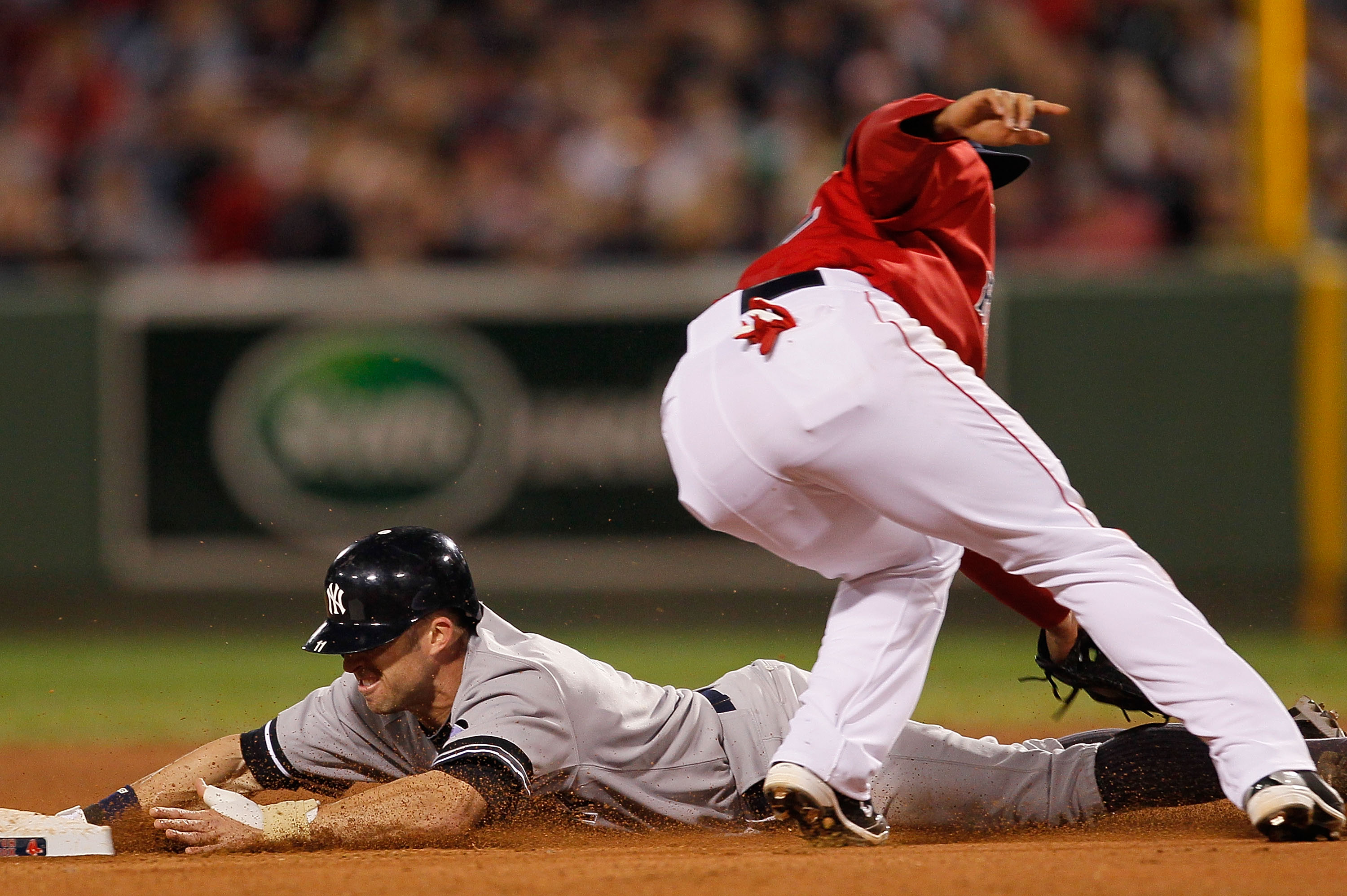 BOSTON - OCTOBER 2:  Brett Gardner #11 of the New York Yankees steals second as Felipe Lopez #32 of the Boston Red Sox covers second base during the first game of a doubleheader at Fenway Park October 2, 2010 in Boston, Massachusetts. (Photo by Jim Rogash