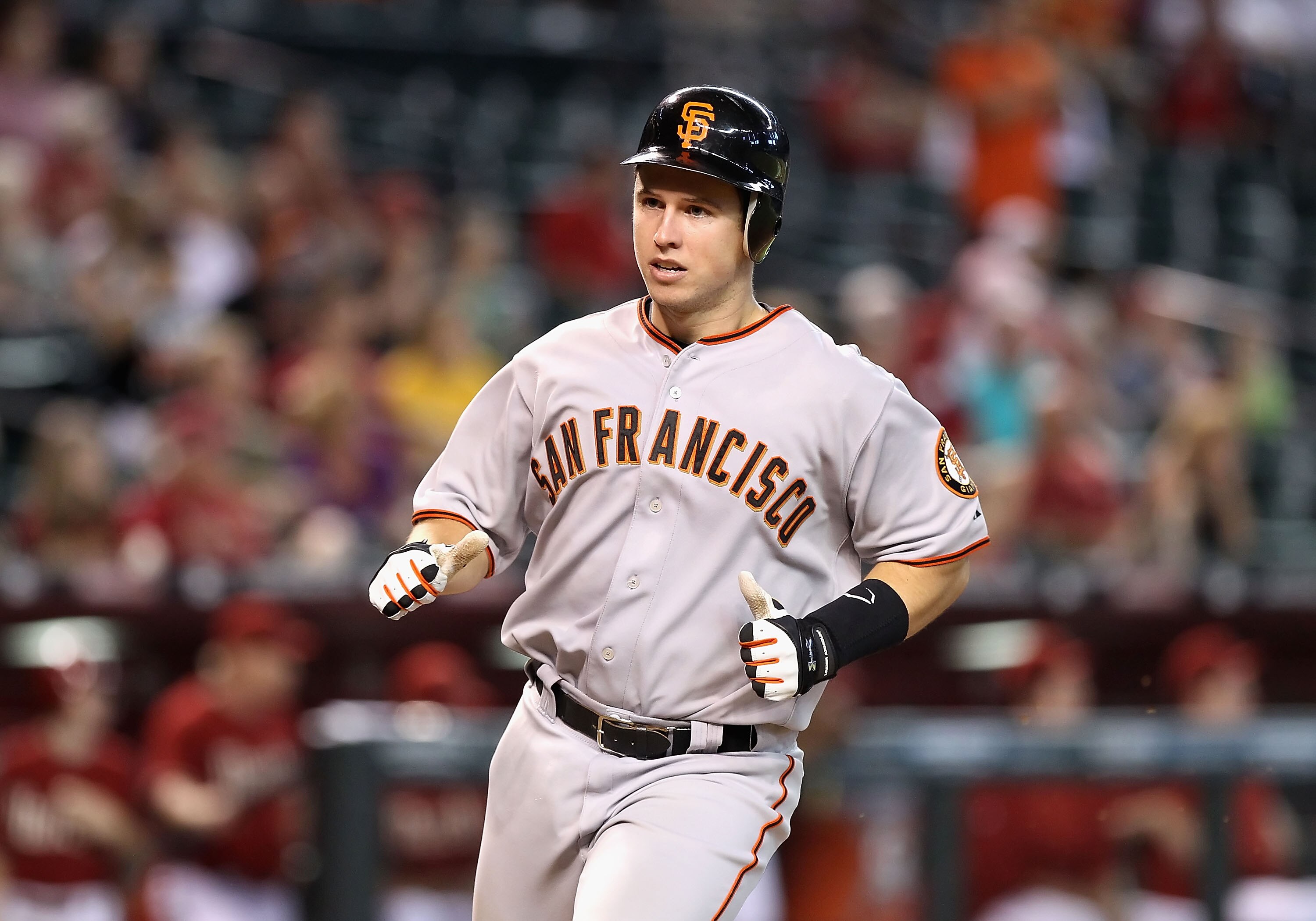 PHOENIX - SEPTEMBER 06:  Catcher Buster Posey #28 of the San Francisco Giants scores a run during the Major League Baseball game against the Arizona Diamondbacks at Chase Field on September 6, 2010 in Phoenix, Arizona. The Giants defeated the Diamondbacks