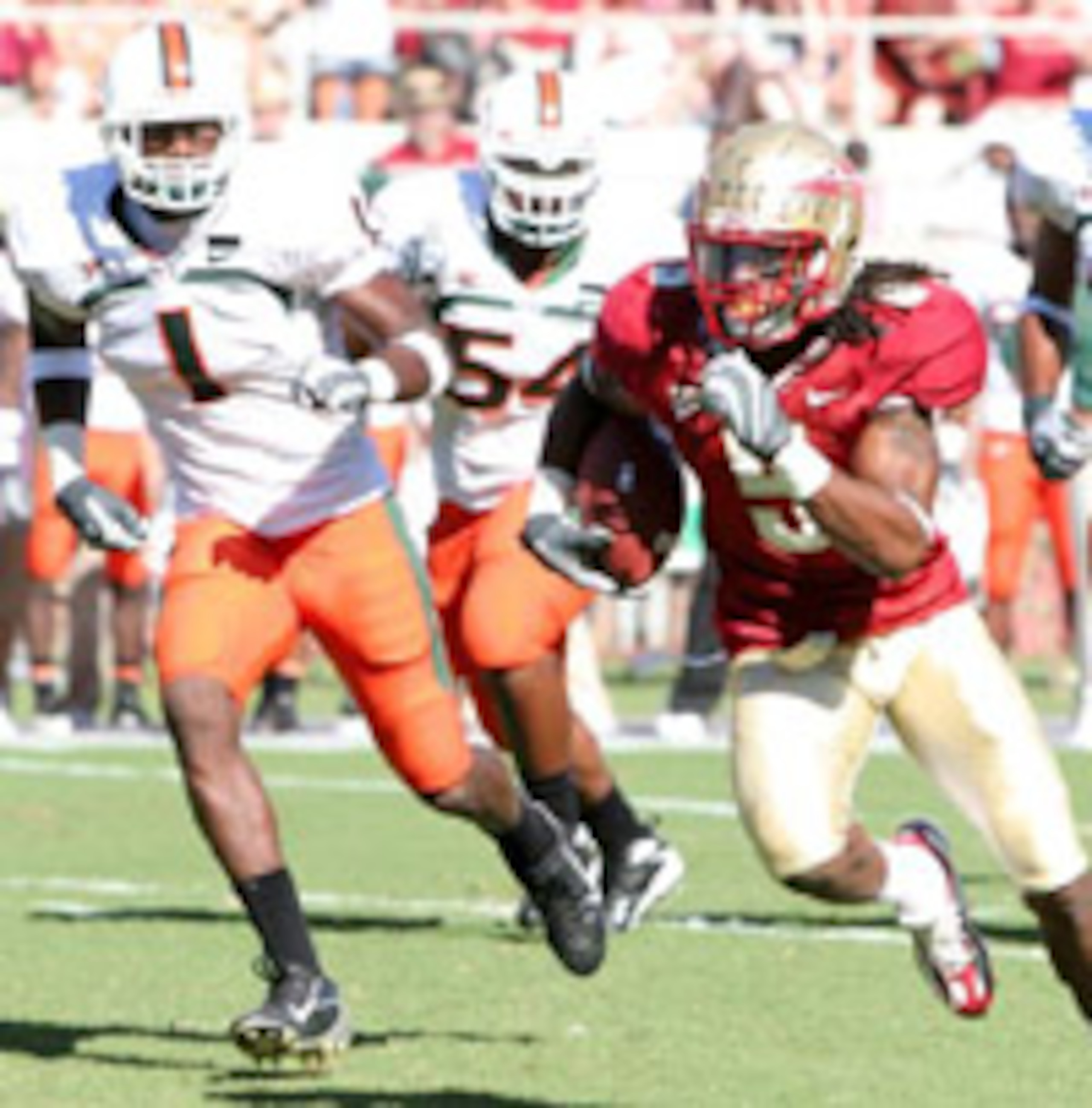 Preston Parker wiggles away from UM defenders but not law enforcement in '07.