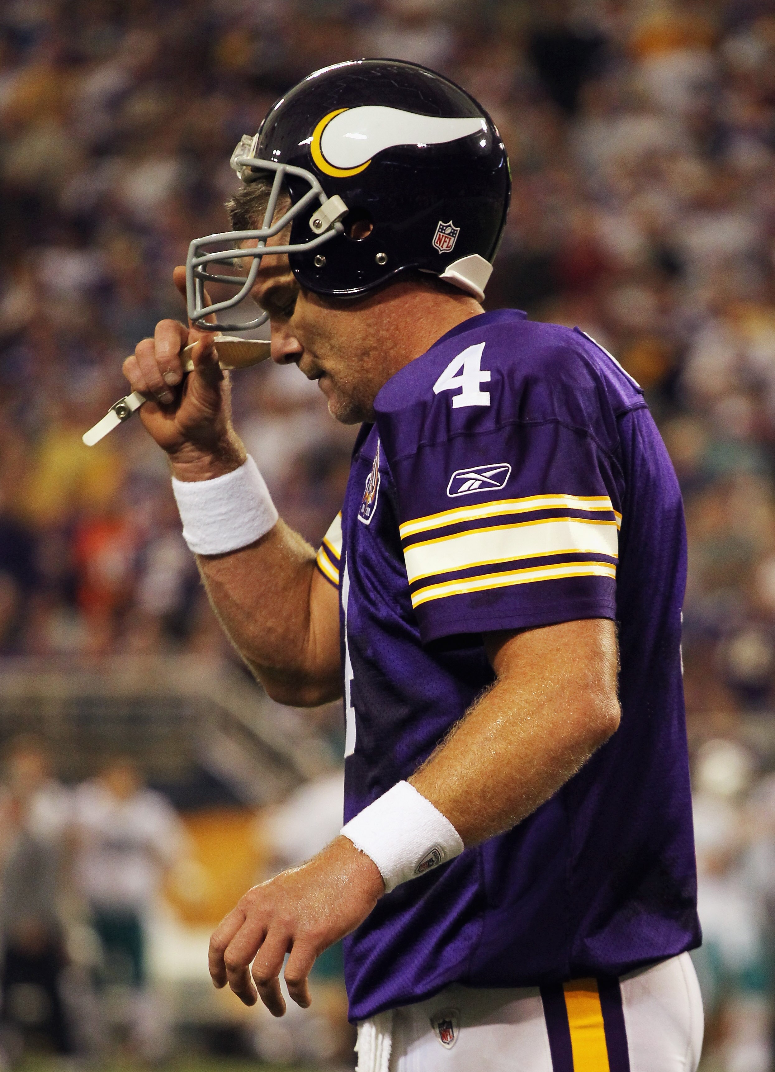 MINNEAPOLIS - SEPTEMBER 19:  Quarterback Brett Favre #4 of the Minnesota Vikings walks off the field after failing to make a first down during the second half of the game against the Miami Dolphins on September 19, 2010 at Hubert H. Humphrey Metrodome in 