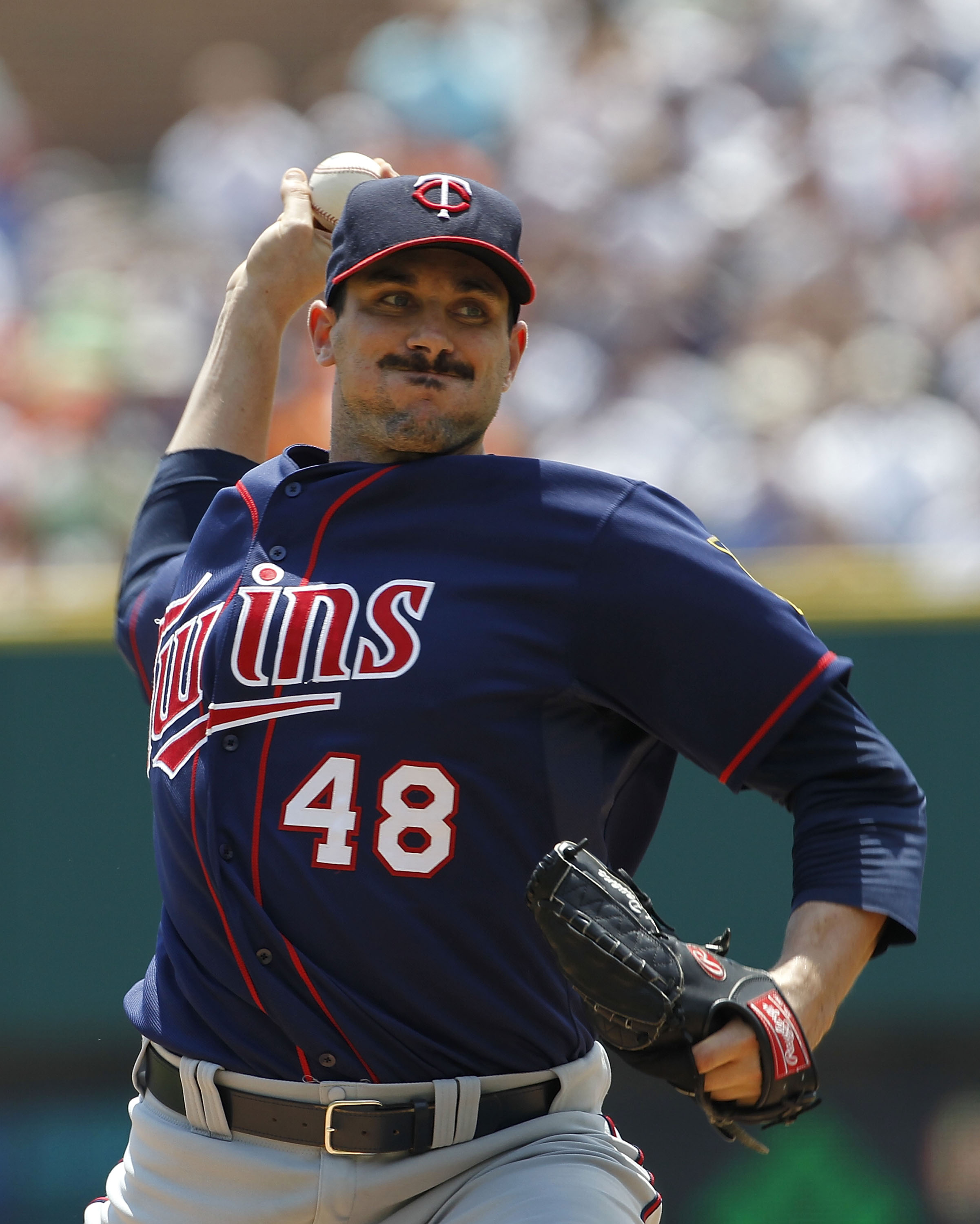 DETROIT - JULY 11: Carl Pavano #48 of the Minnesota Twins pitches in the first inning during the game against the Detroit Tigers on July 11, 2010 at Comerica Park in Detroit, Michigan.  (Photo by Leon Halip/Getty Images)