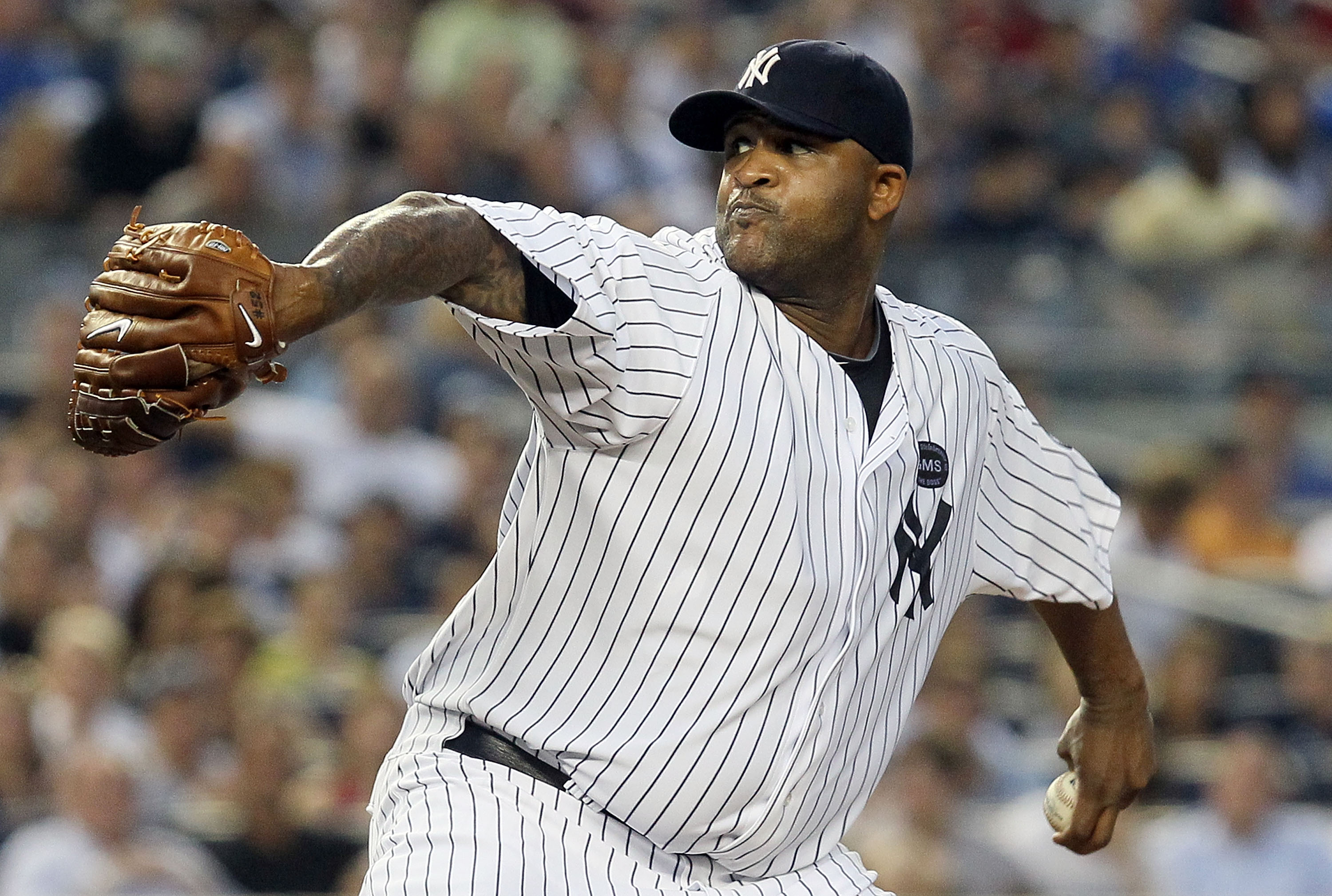 NEW YORK - JULY 16:  CC Sabathia #52 of the New York Yankees delivers a pitch against the Tampa Bay Rays on July 16, 2010 at Yankee Stadium in the Bronx borough of New York City.  (Photo by Jim McIsaac/Getty Images)
