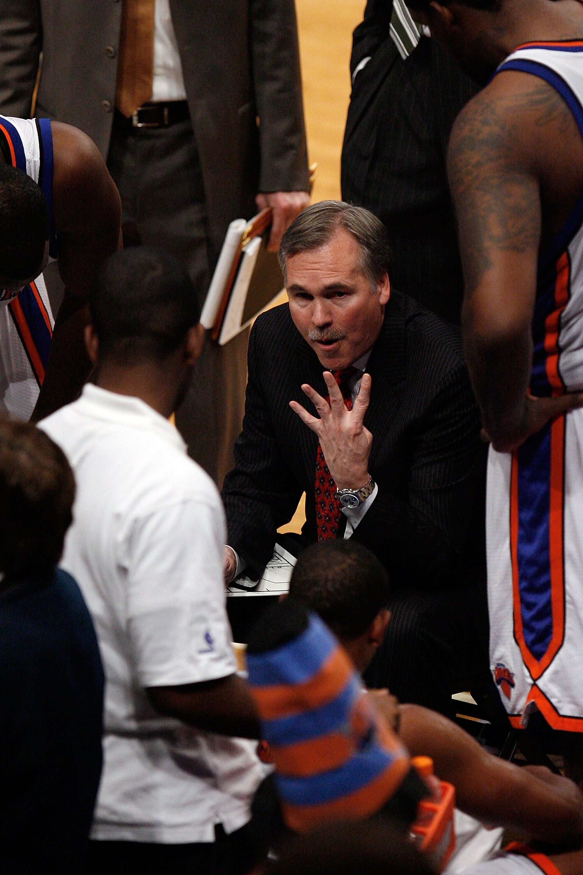 NEW YORK - OCTOBER 24: Head coach Mike D'Antoni of the New York Knicks speaks to his team during a timeout in the second half of a pre-season game against the New Jersey Nets on October 24, 2008 at Madison Square Garden in New York City. The Nets won 111 NEW YORK - OCTOBER 24: Head coach Mike D'Antoni of the New York Knicks speaks to his team during a timeout in the second half of a pre-season game against the New Jersey Nets on October 24, 2008 at Madison Square Garden in New York City. The Nets won 111
