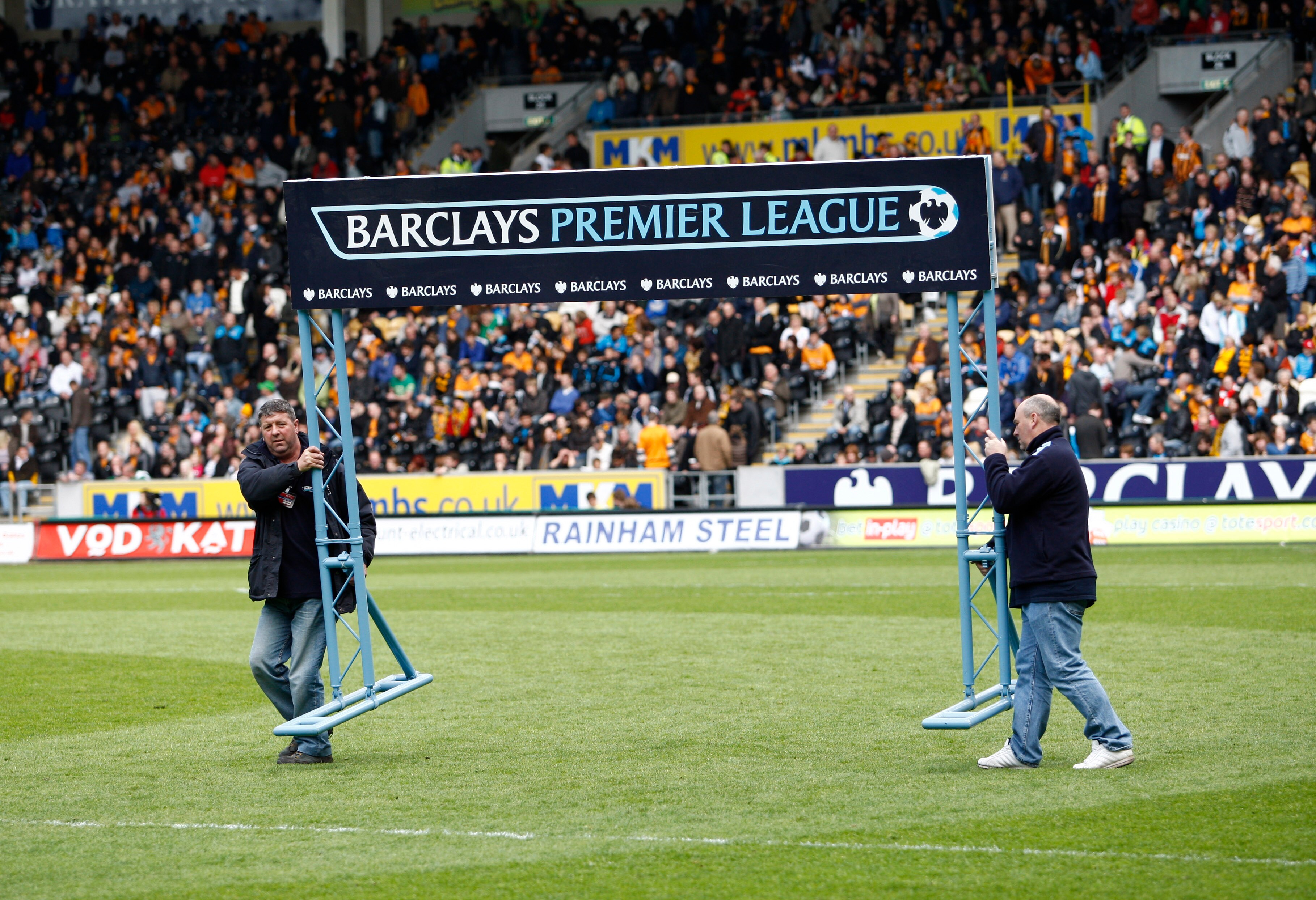 HULL, ENGLAND - MAY 9: The Barclay Premier League sign is removed from the pitch just before the start of the final premier league game at relegated Hull City's KC stadium during the Barclays Premier League match between Hull City and Liverpool at the KC 