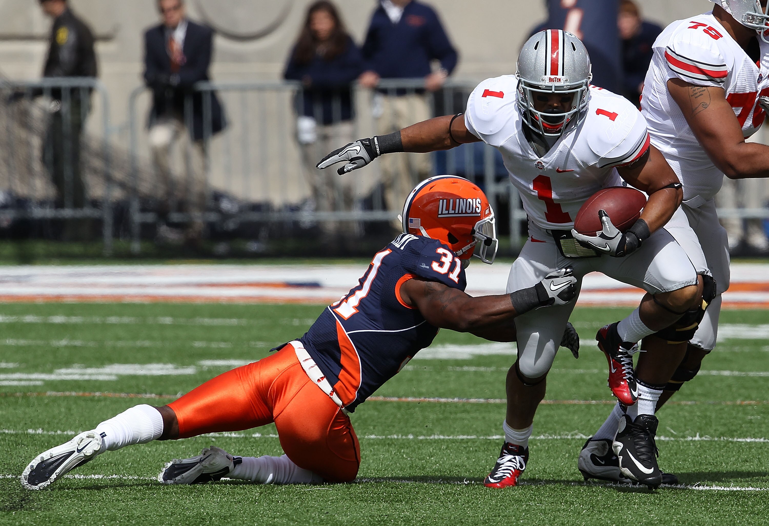 CHAMPAIGN, IL - OCTOBER 02: Dan Herron #1 of the Ohio State Buckeyes breaks away from Travon Bellamy #31 of the Illinois Fighting Illini at Memorial Stadium on October 2, 2010 in Champaign, Illinois. Ohio State defeated Illinois 24-13. (Photo by Jonathan 