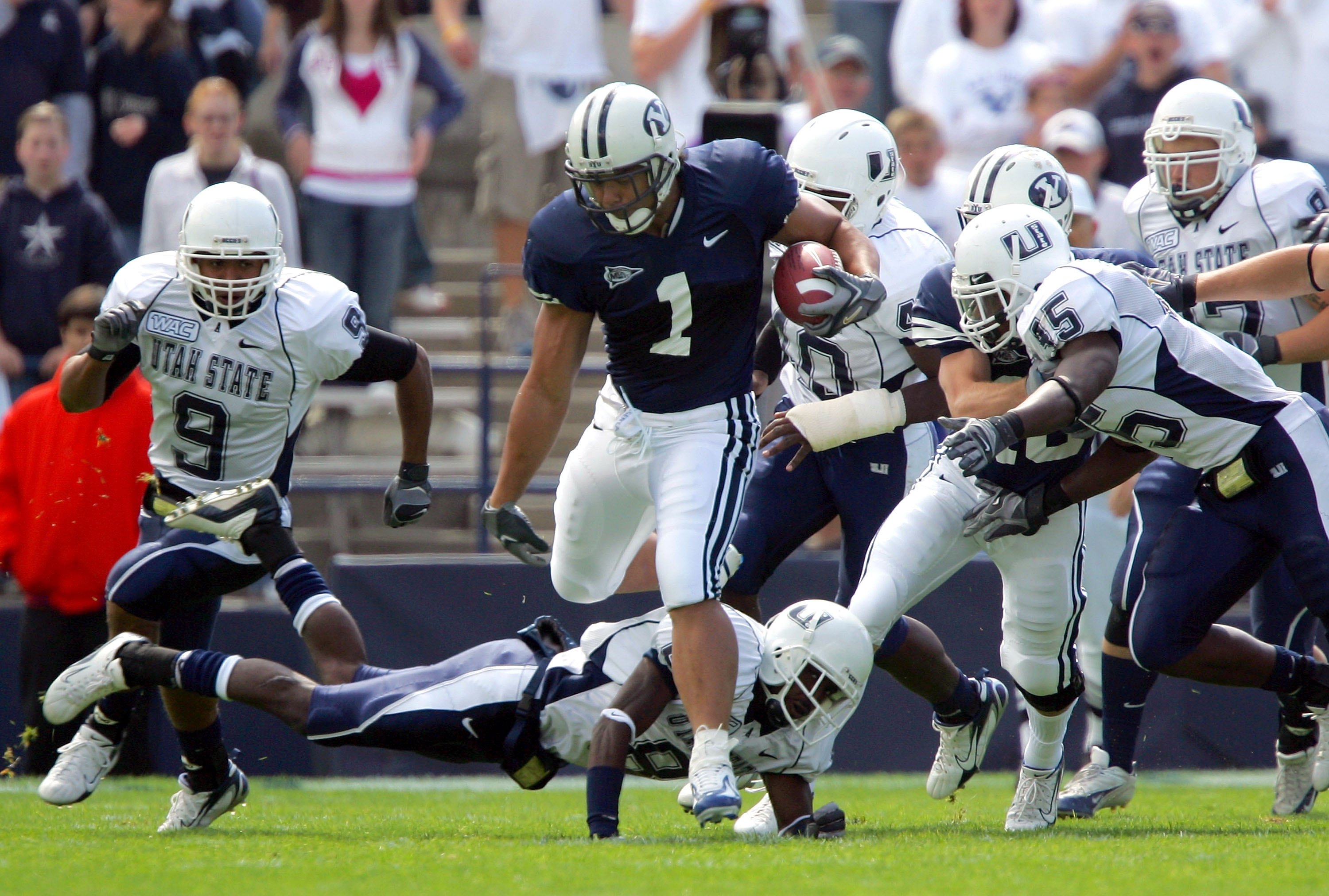 PROVO, UT - SEPTEMBER 23:  Fui Vakapuna #1 of the Brigham Young Cougars runs with the ball against the Utah State Aggies on September 23, 2006 at La Vell Edwards Stadium in Provo, Utah.  (Photo By Kent Horner/Getty Images)