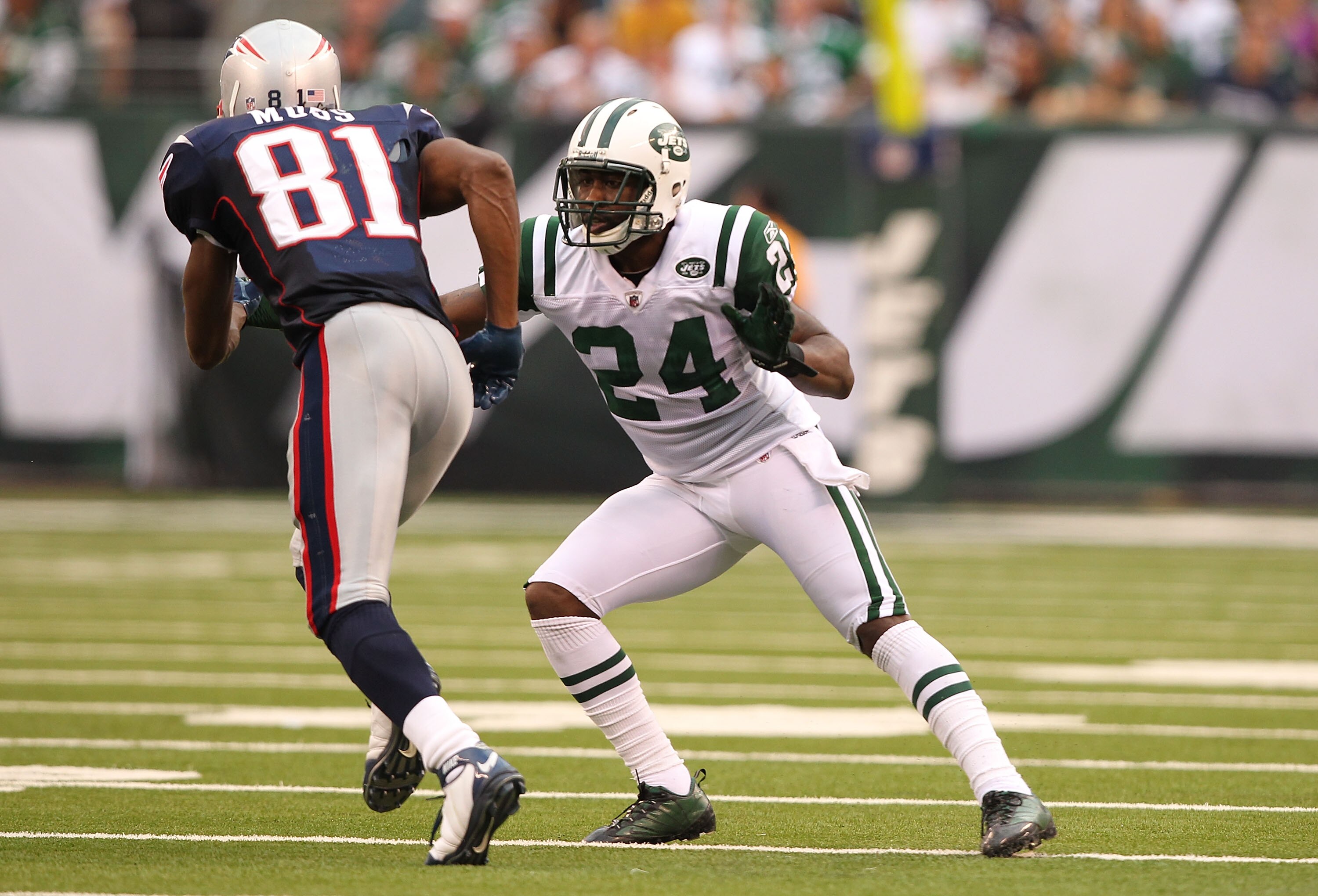 EAST RUTHERFORD, NJ - SEPTEMBER 19:  Darrelle Revis #24 of the New York Jets defends against Randy Moss #81 of the New England Patriots during their  game on September 19, 2010 at the New Meadowlands Stadium  in East Rutherford, New Jersey.  (Photo by Al 