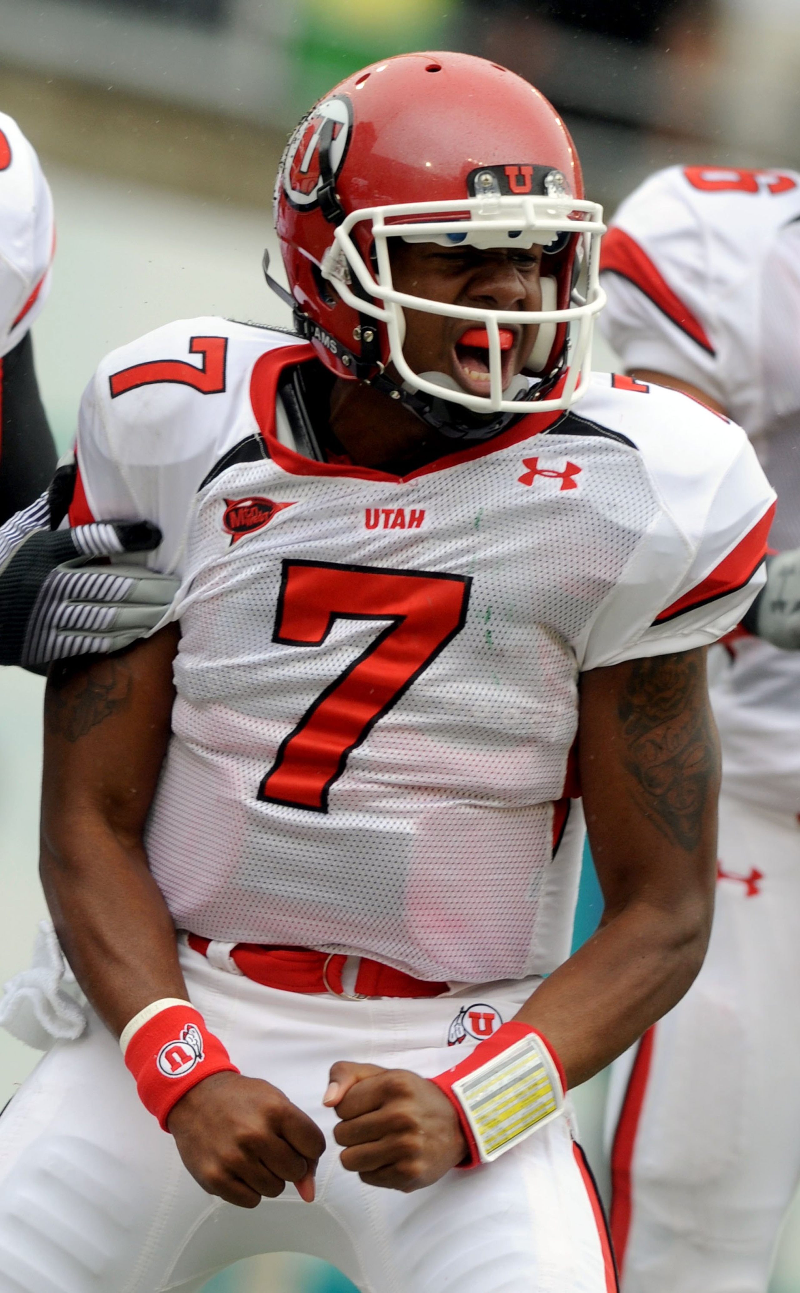 EUGENE, OR - SEPTEMBER 19: Quarterback Terrance Cain #7 of the Utah Utes celebrates his touchdown in the first quarter of the game against the Oregon Ducks at Autzen Stadium on September 19, 2009 in Eugene, Oregon. Oregon won the game 31-24. (Photo by Ste