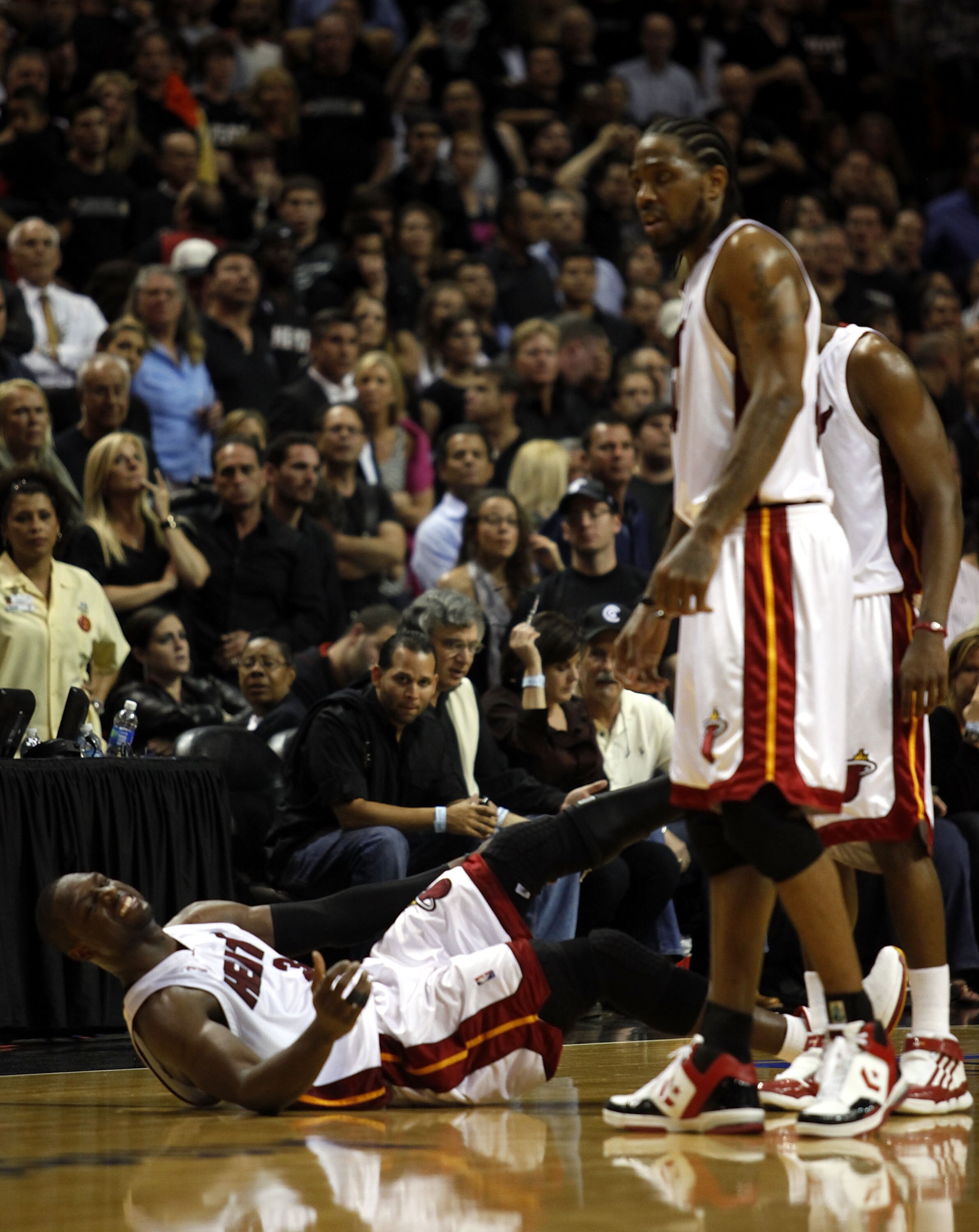MIAMI - APRIL 23:  Guard Dwyane Wade #3 of the Miami Heat stays on the floor injured during a 100-98 loss to the Boston Celtics in Game Three of the Eastern Conference Quarterfinals during the 2010 NBA Playoffs at American Airlines Arena on April 23, 2010