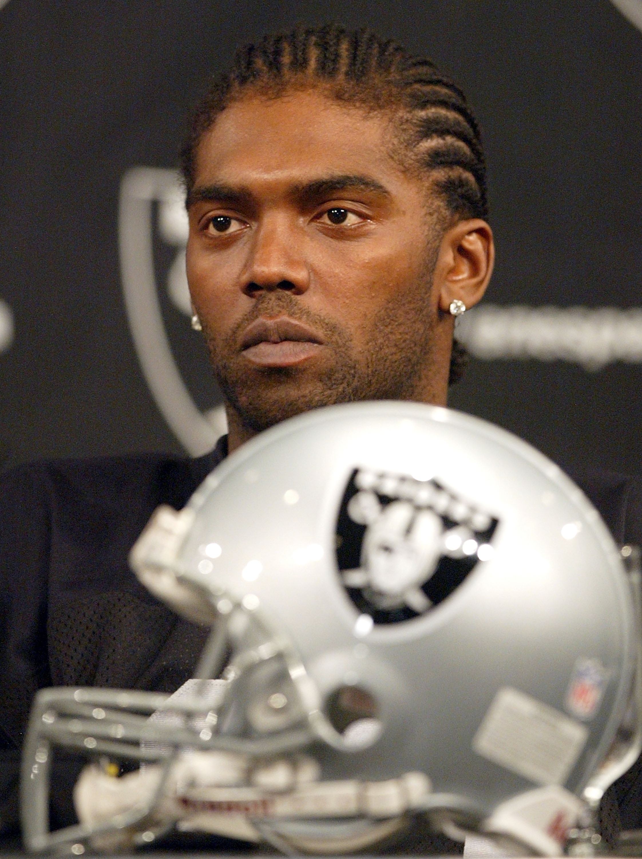 ALAMEDA, CA - MARCH 2:  New Oakland Raiders wide receiver Randy Moss #18 speaks during a news conference March 2, 2005 in Alameda, California. The former Minnesota Vikings was introduced by his new team today and the Raiders are working to restructure his