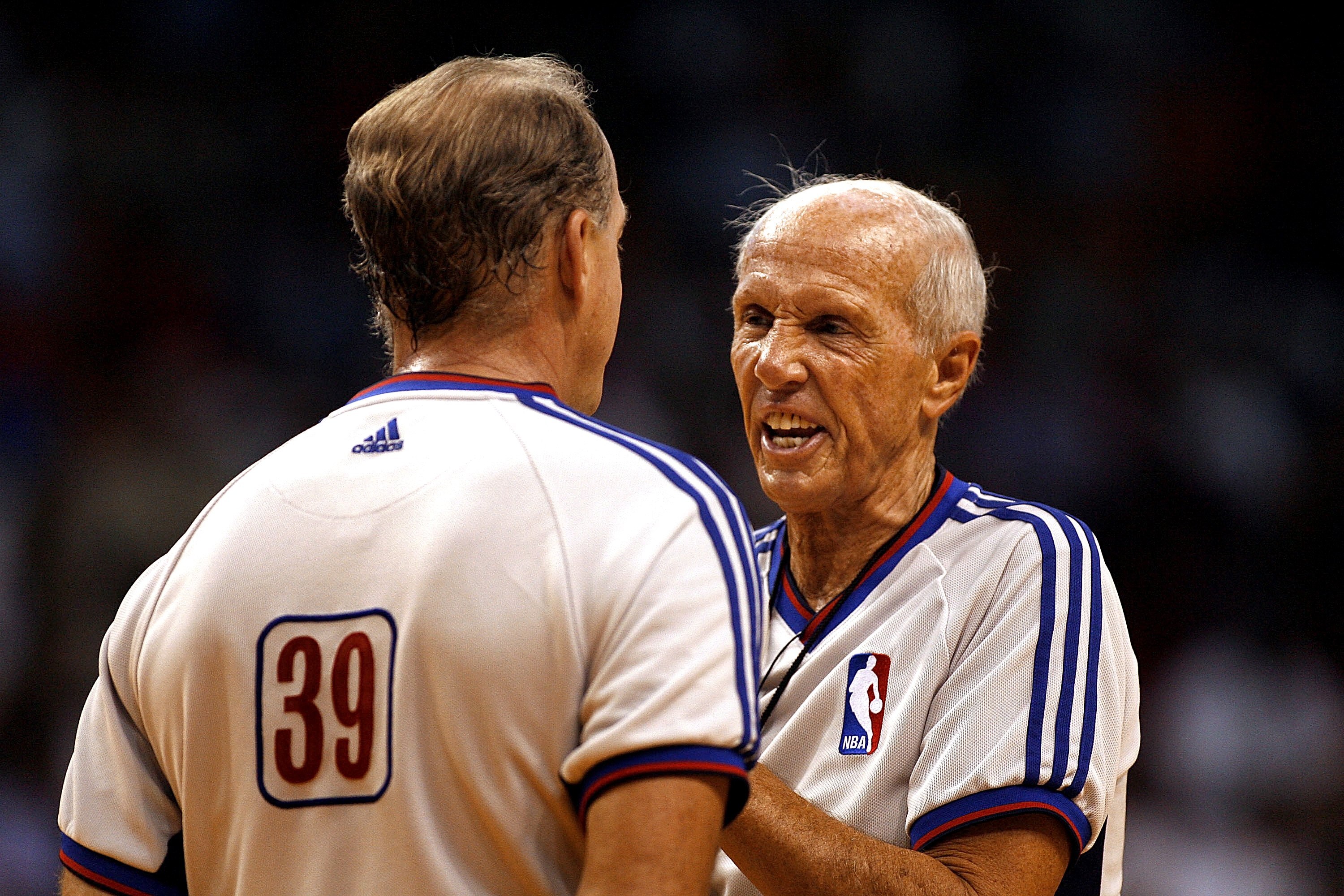 MIAMI - DECEMBER 11: Referee Dick Bavetta chats with fellow Referee Kevin Fehr during a timeout while the Toronto Raptors play the Miami Heat on December 11, 2006 at the American Airlines Arena in Miami  Florida. NOTE TO USER: User expressly acknowledges